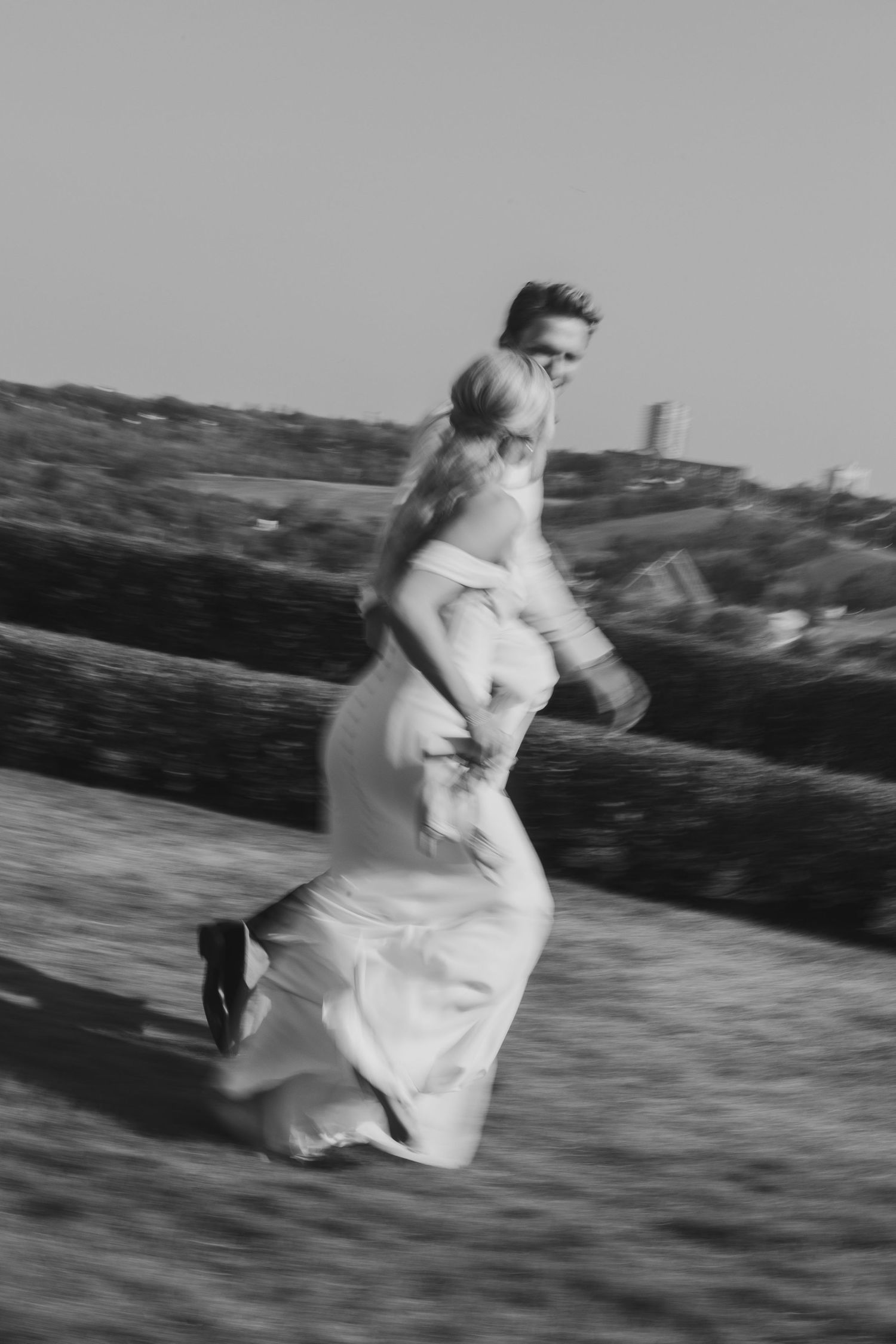 couple running on wedding day