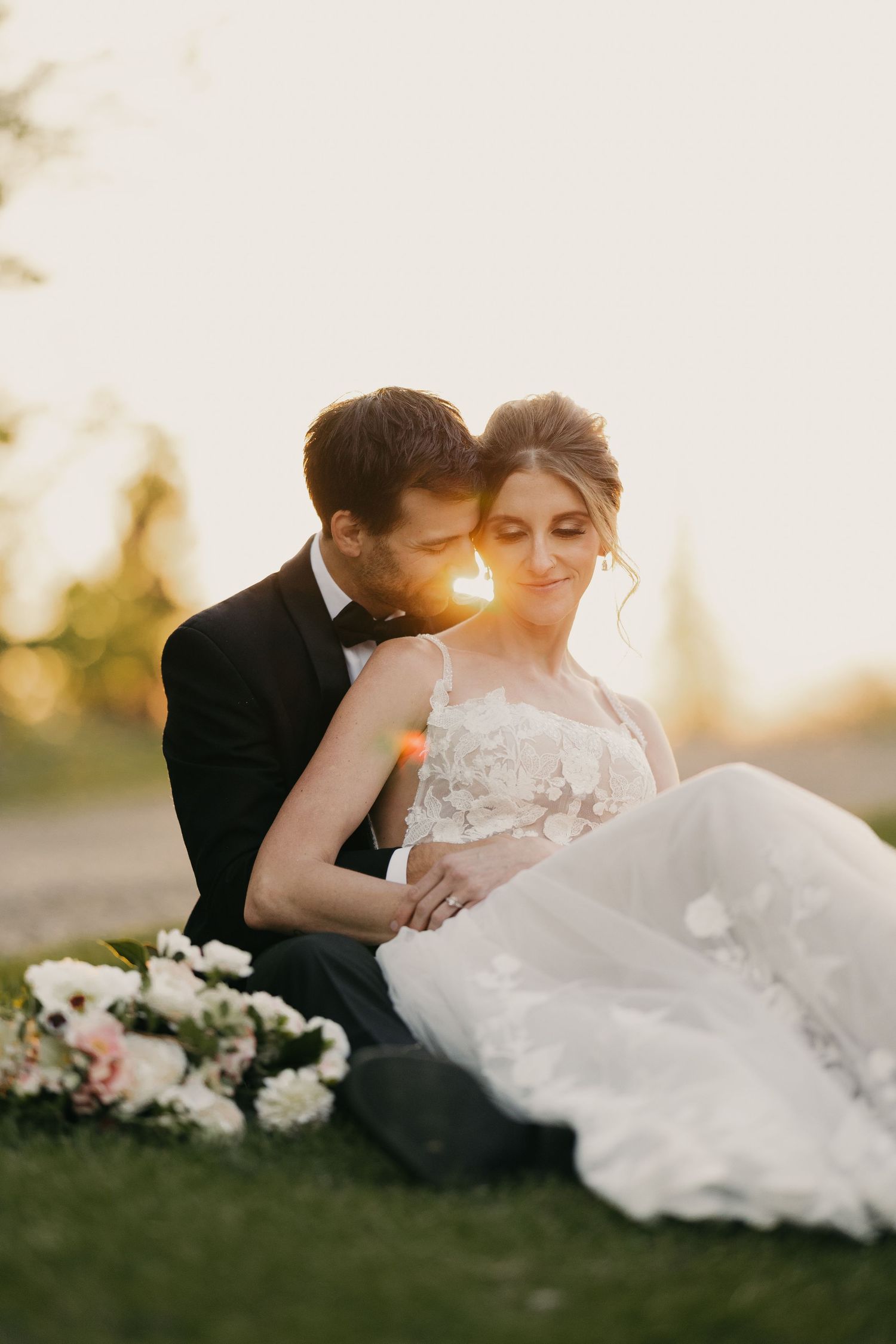 sunset of wedding couple sitting down