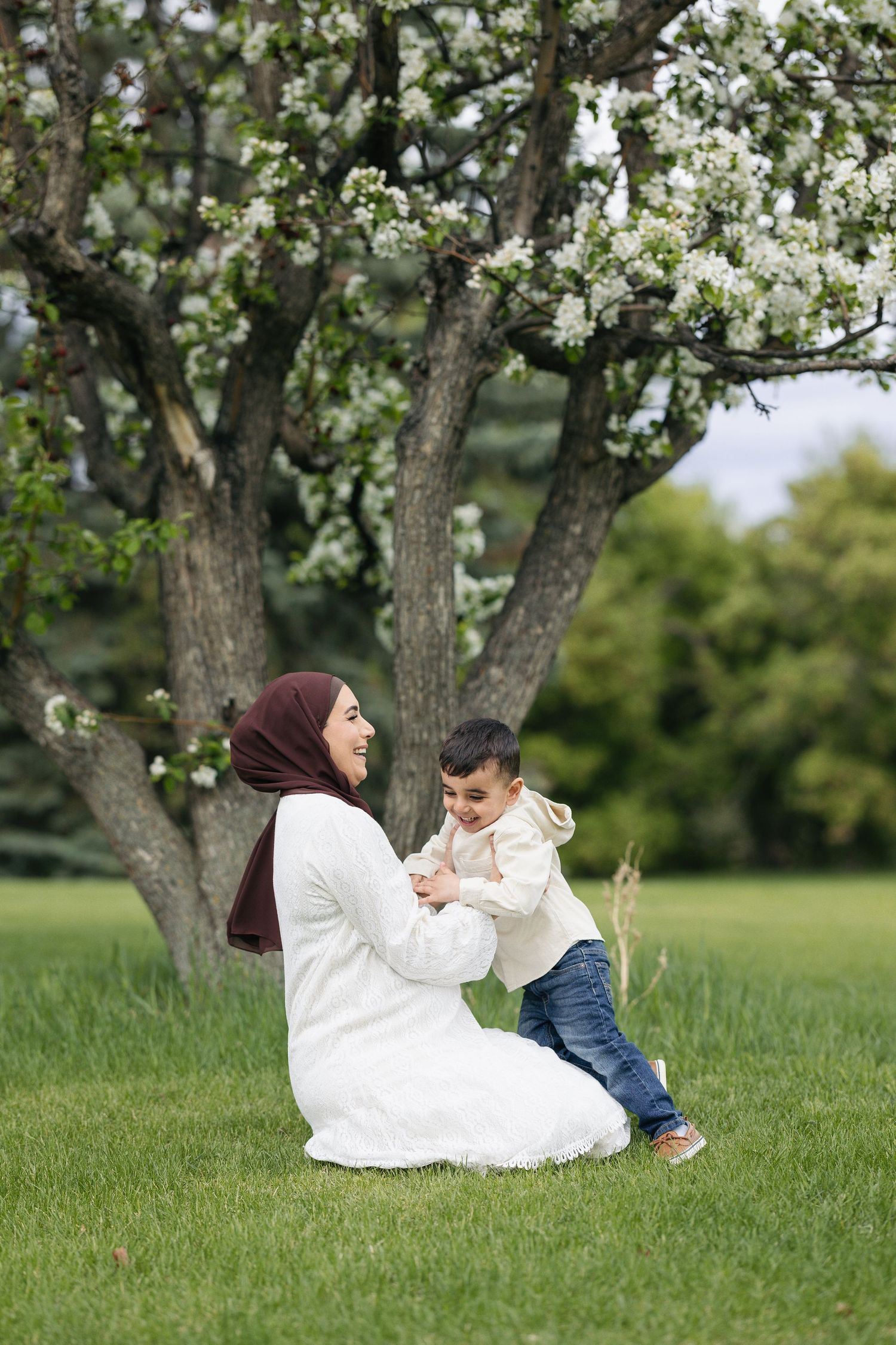 maternity session during blossom season with mom and son