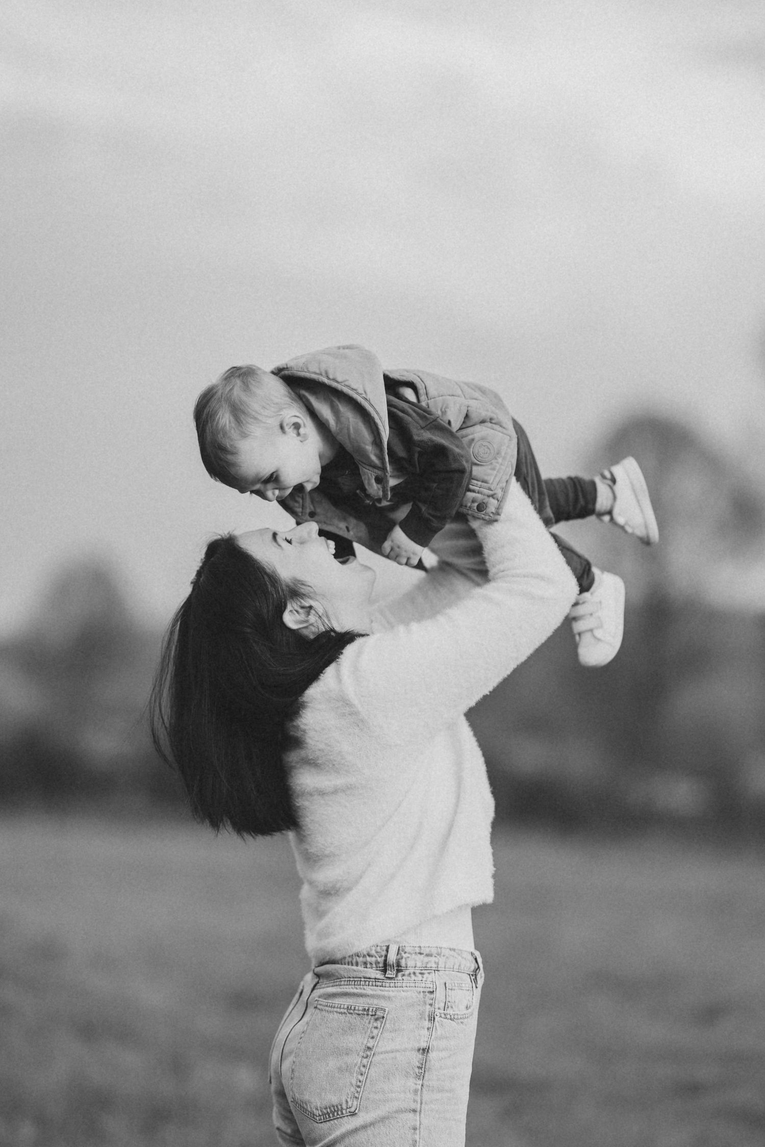baby getting lifted by mom