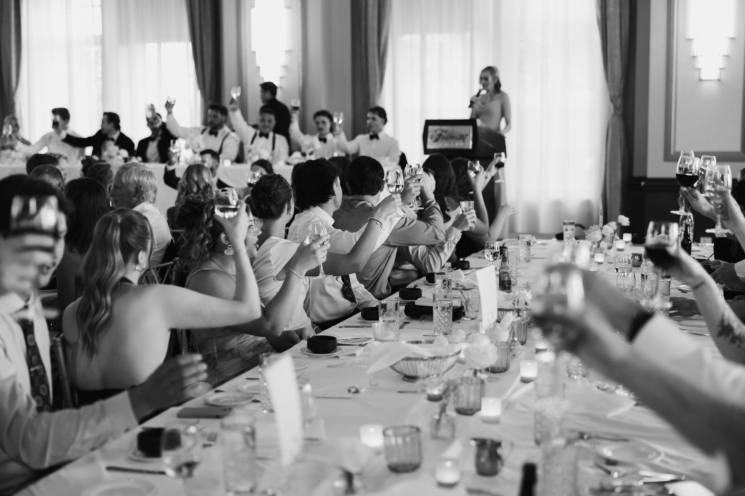 fairmont reception in black and white capturing a cheers
