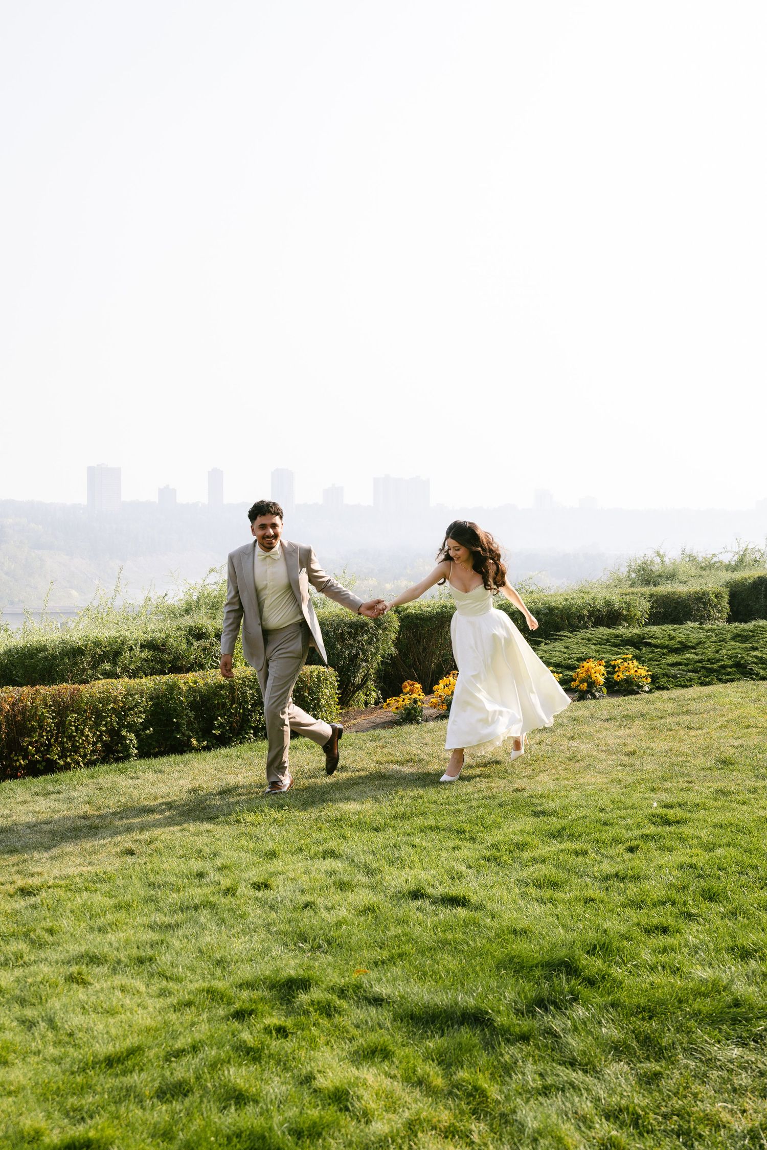 engagement session of couple running