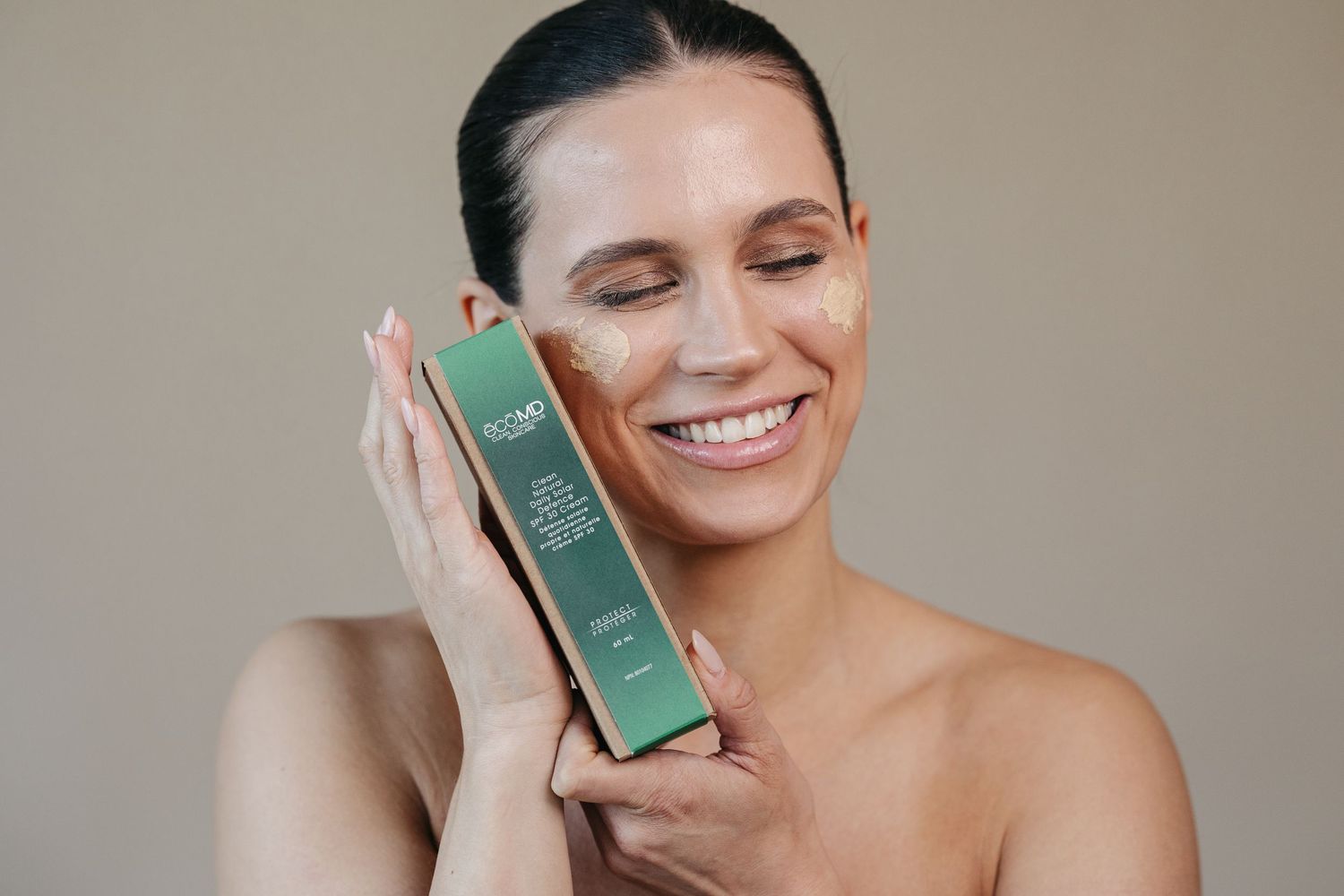 Studio branding photographer in Edmonton capturing model showcasing skin care brand, captured by Marcu fotography