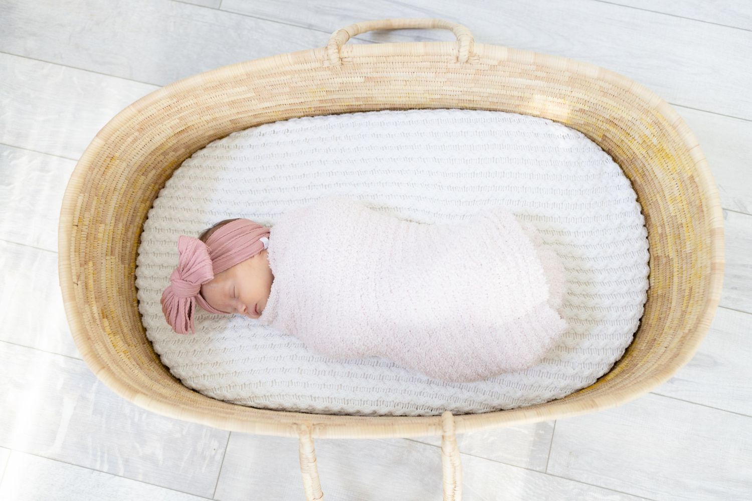 White moses basket with soft padding displayed in sequence.