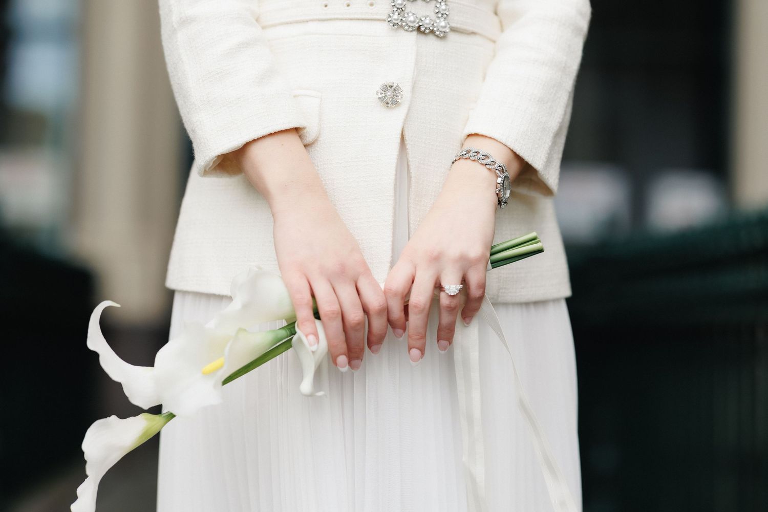 Bride holding white calla lilies during an intimate Melbourne wedding.