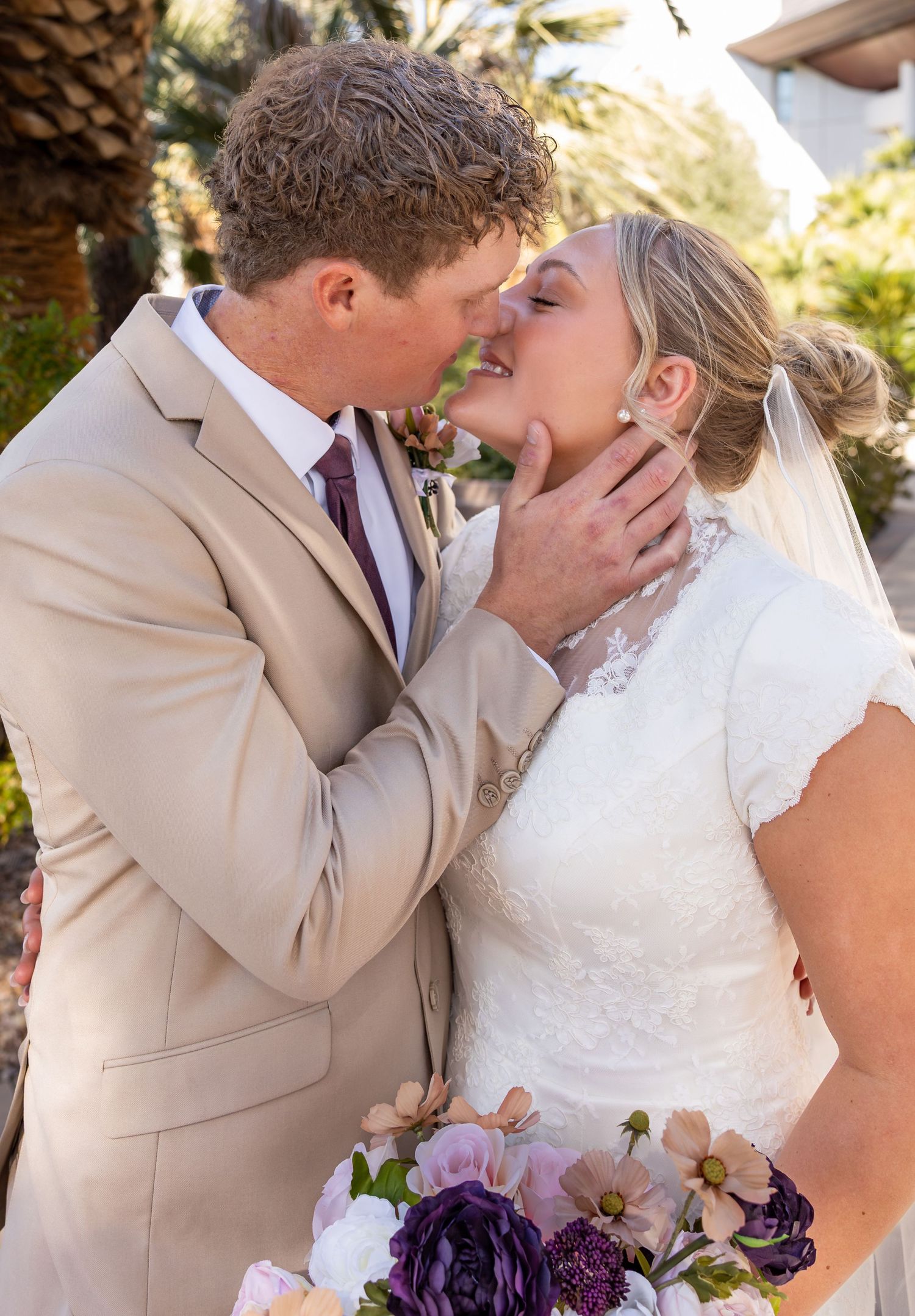 A bride and groom are about to kiss each other during their bridal shoot at the Las Vegas Temple.