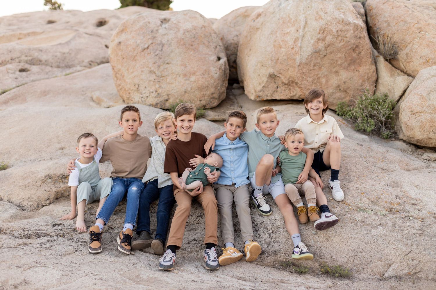 A group of boy cousins gathered together during an extended family photoshoot at Three Peaks.