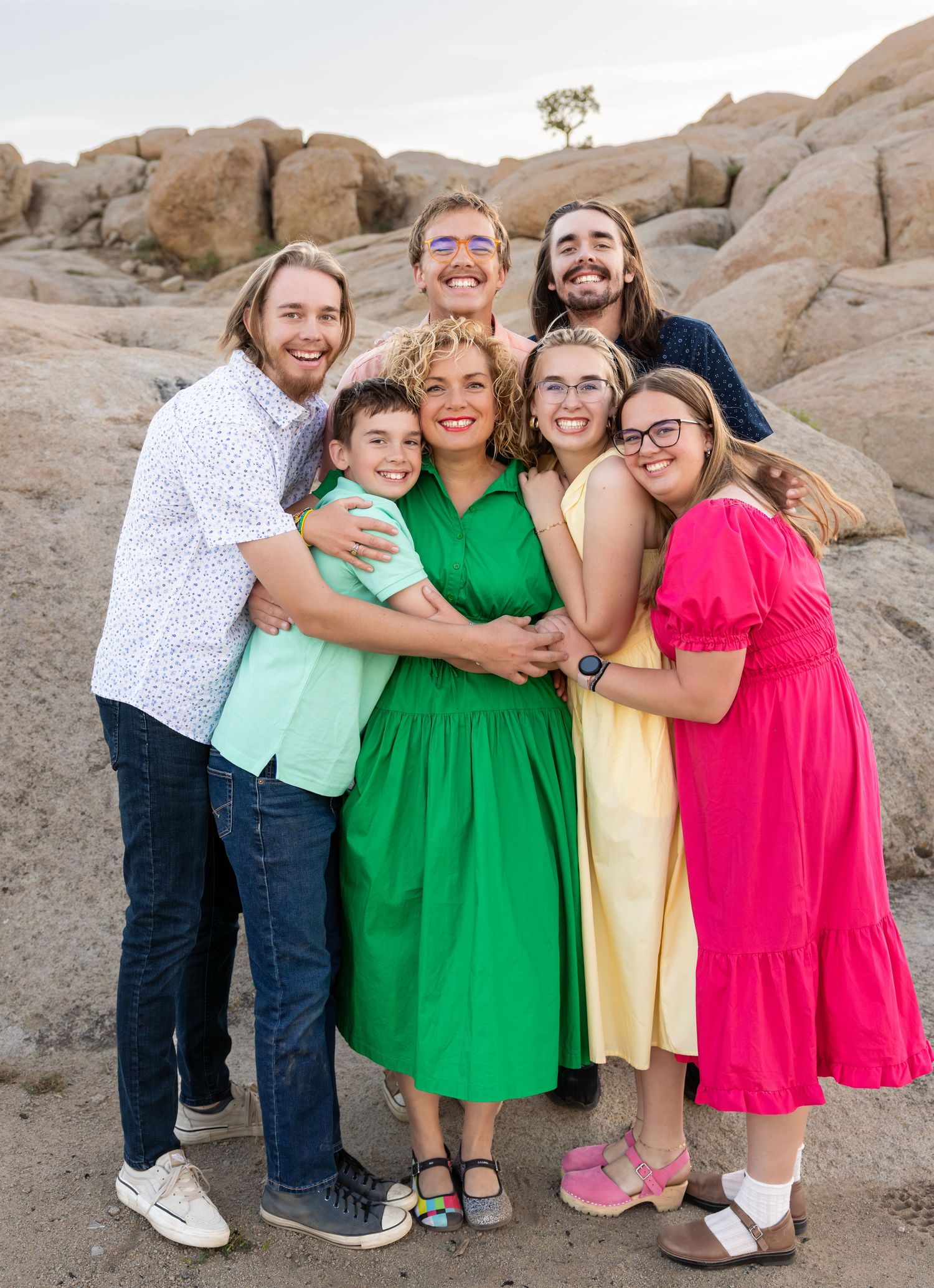 Happy family hugging their mom during a Southern Utah Family photography session in Cedar City, Utah.