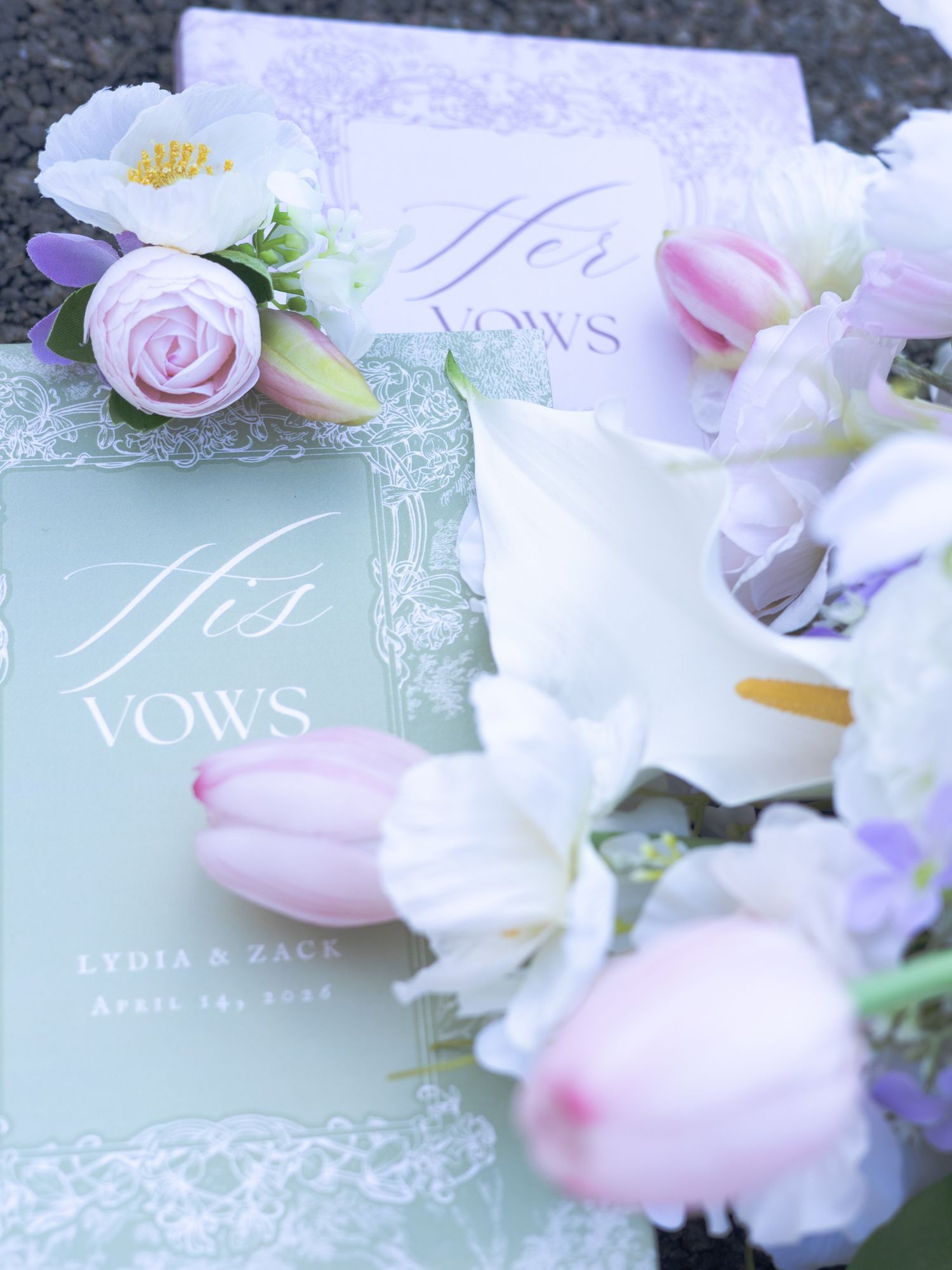 His and Her vows books with pink tulips and roses for a wedding by Lydia and Zack on April 14, 2022.