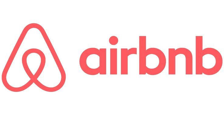 Airbnb coral pink logo featuring iconic Belo symbol beside lowercase brand name on white background.