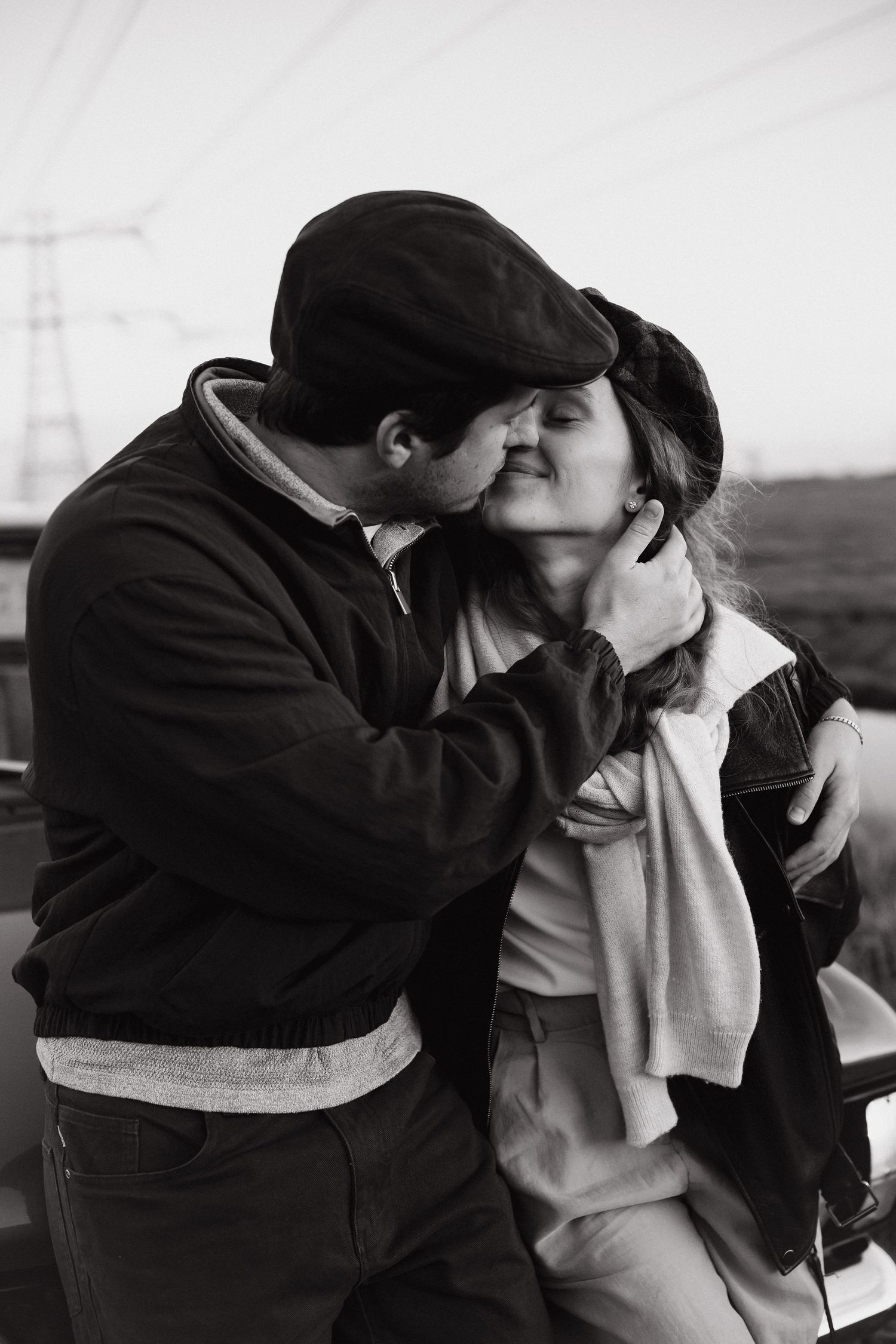Black and white portrait of a couple kissing