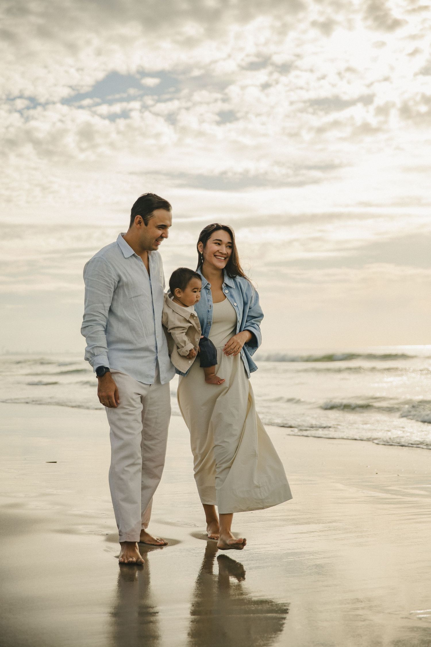 Family walking together along the beach