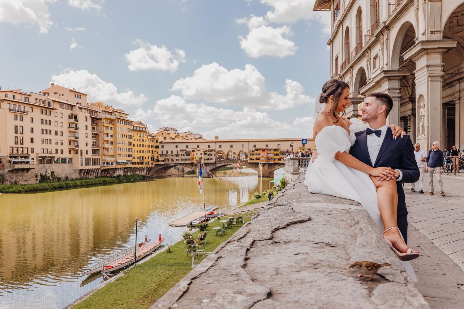 A couple poses together in various romantic locations around Florence, Italy including the iconic Ponte Vecchio bridge.