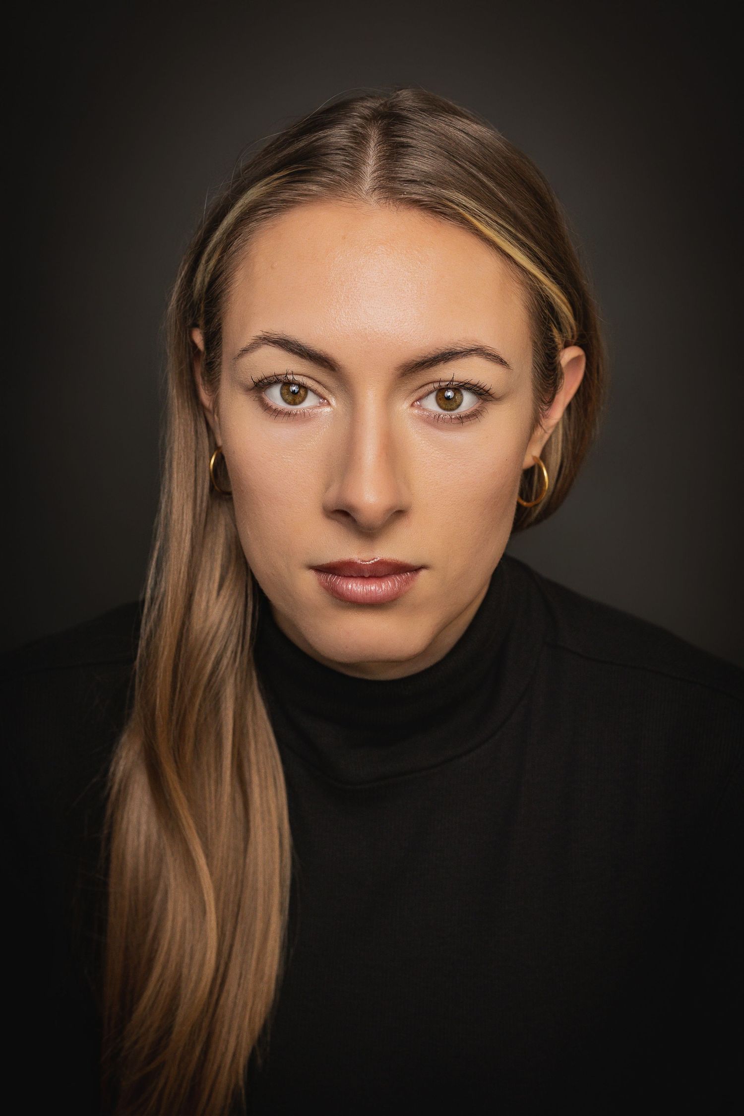 A dramatic portrait series showing different angles of a woman in a black turtleneck against a dark background.