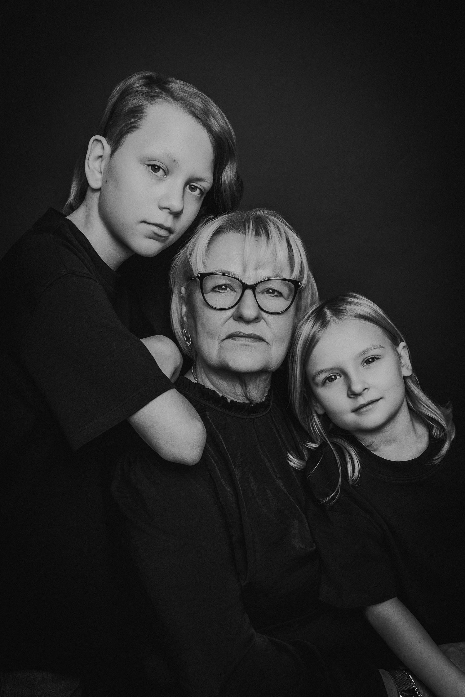 A series of black and white artistic portrait photographs showing close-up compositions with dramatic lighting and shadows.
