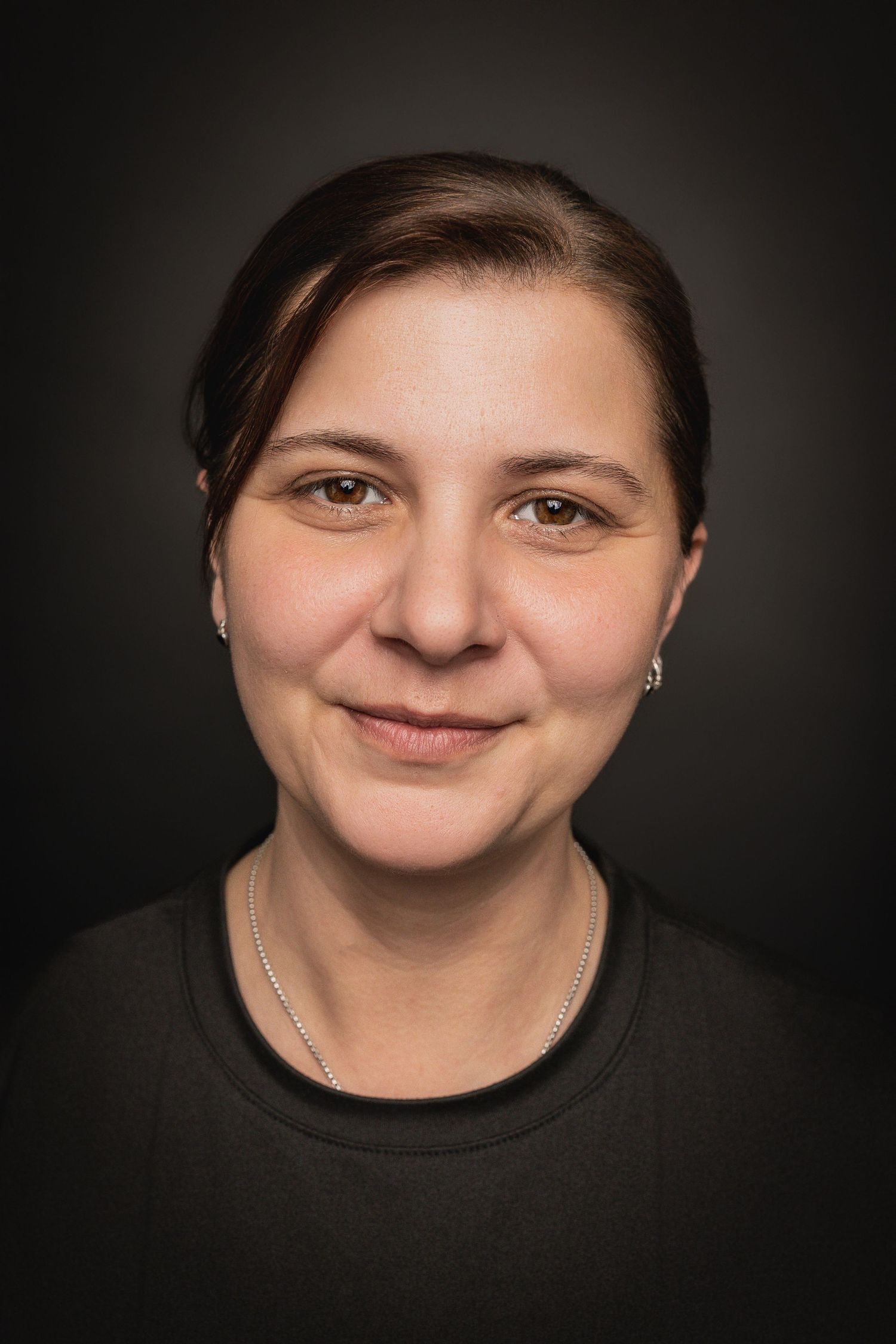 Portrait photo series showing different facial expressions against a dark background.