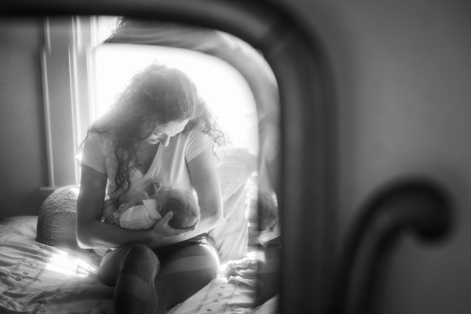 Artistic black and white photo series through window frame creates dreamy atmosphere.