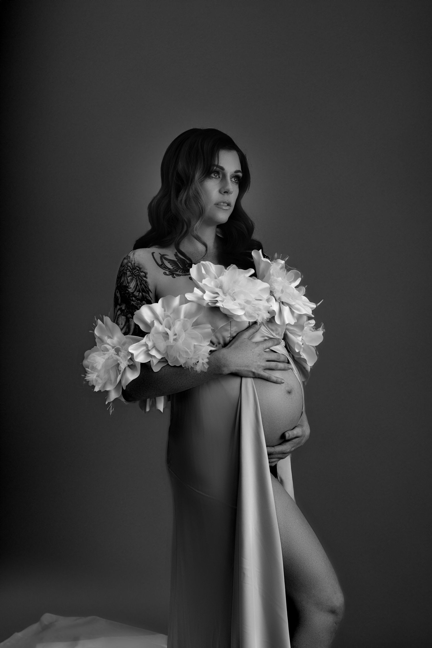 Empowering maternity boudoir session in Salt Lake City, capturing the sensual beauty and confidence of expecting mothers