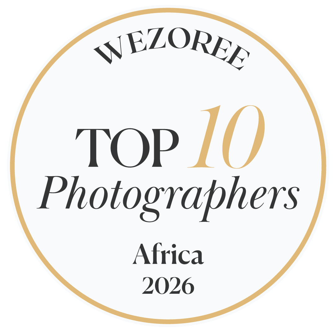 Wezoree Top 10 Photographers Africa 2026 award badge with gold circle border on white background.