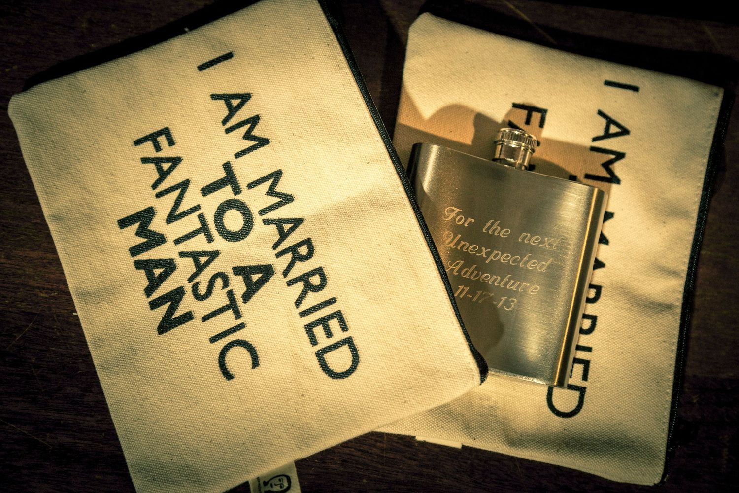 Flask engraved with wedding message beside fabric bag reading I Am Married To A Fantastic Man.