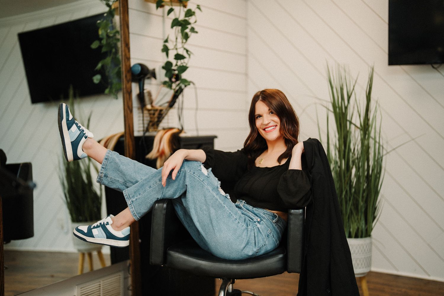 Lifestyle photoshoot in a modern home with plants and white shiplap walls. Fremont, Ohio Hair Salon
