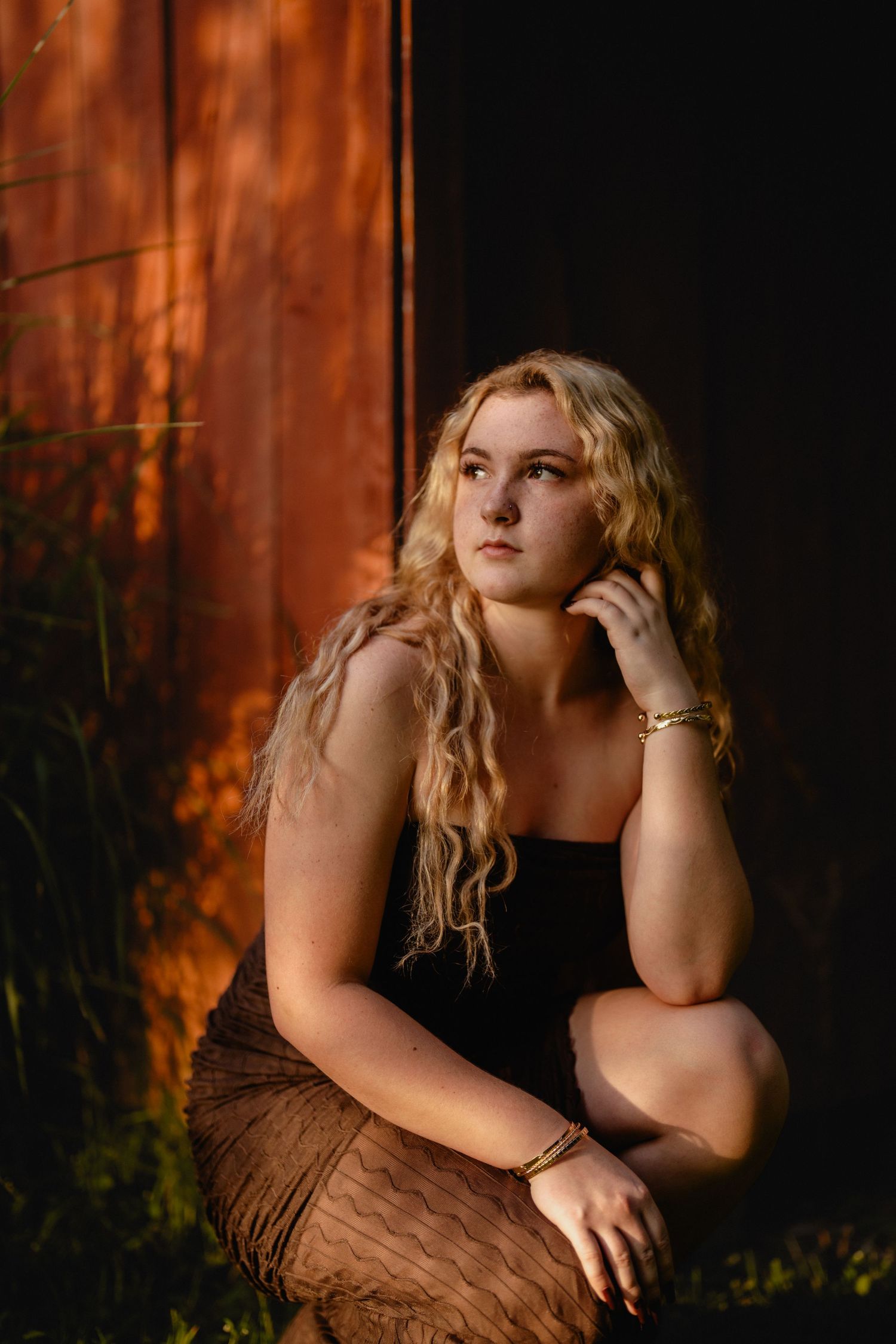 Moody portrait with warm orange lighting against a dark background. Steyer Nature Preserve Tiffin, Oh