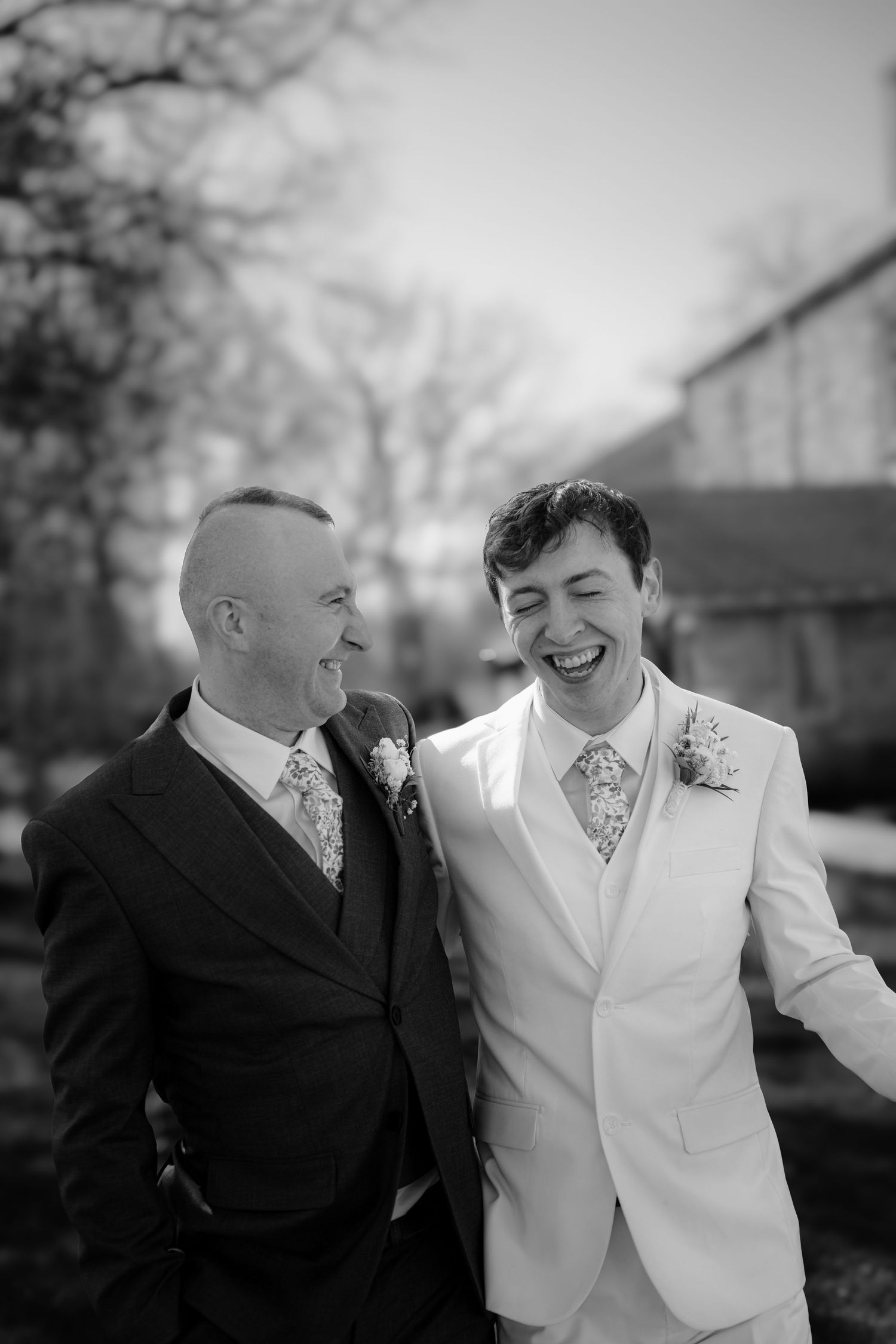 Two people share a joyful moment outdoors in black and white photography. Gideon Owen Winery ohio