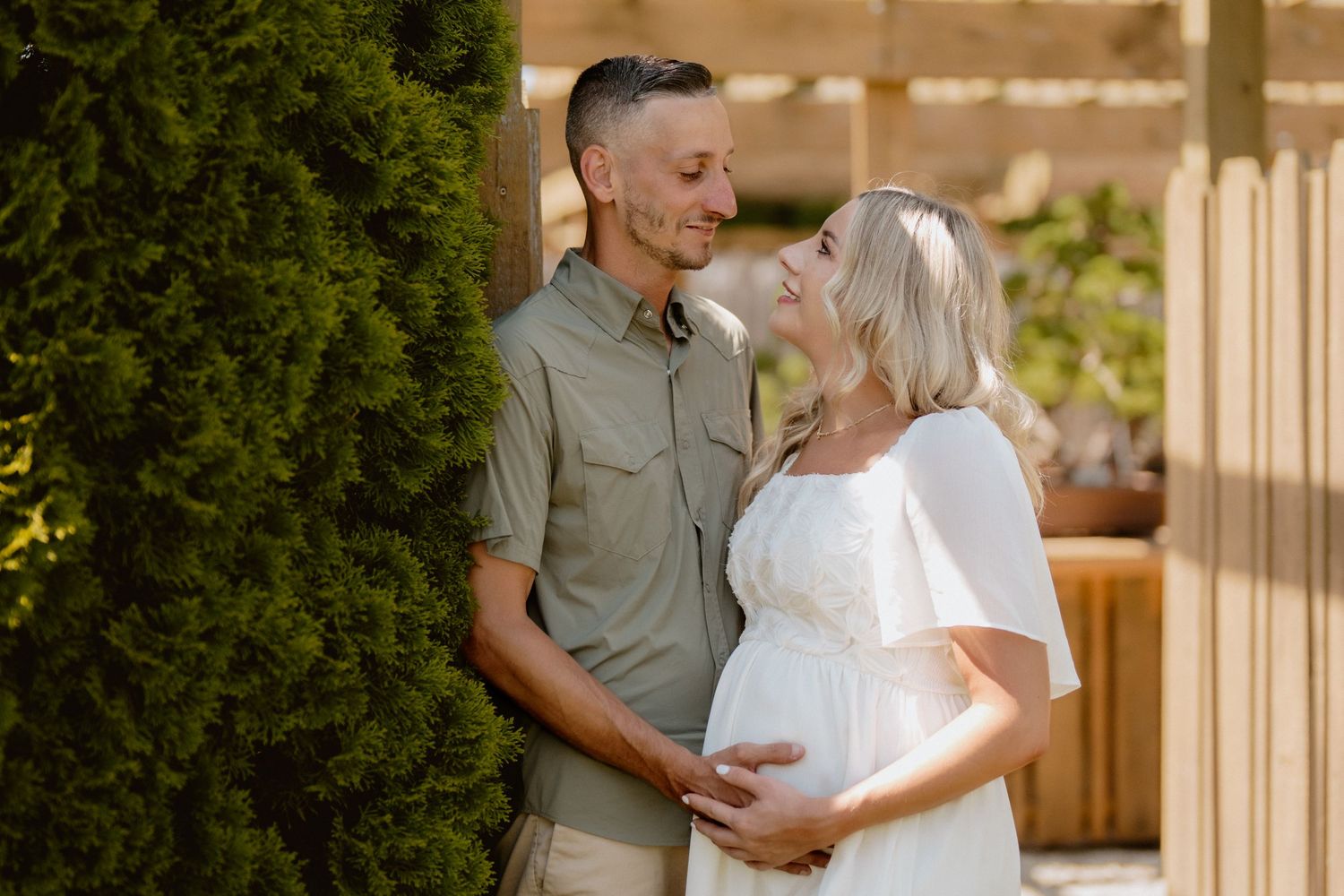 Casual outdoor couple portraits on wooden porch during golden hour. Schedel Gardens, Elmore, Ohio
