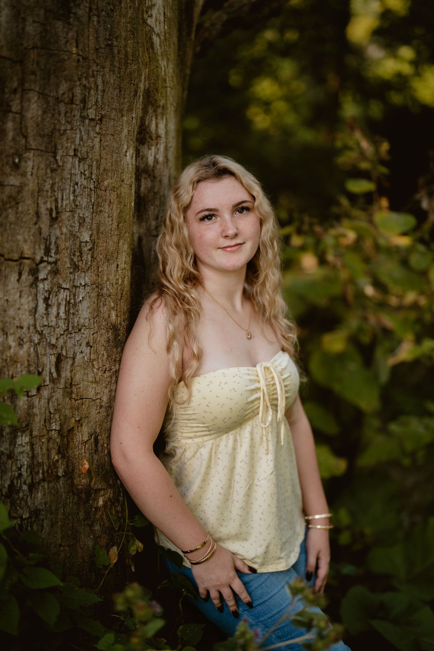 Portrait session in a wooded area featuring yellow summer clothing and natural lighting. Steyer Nature Preserve Tiffin, Oh