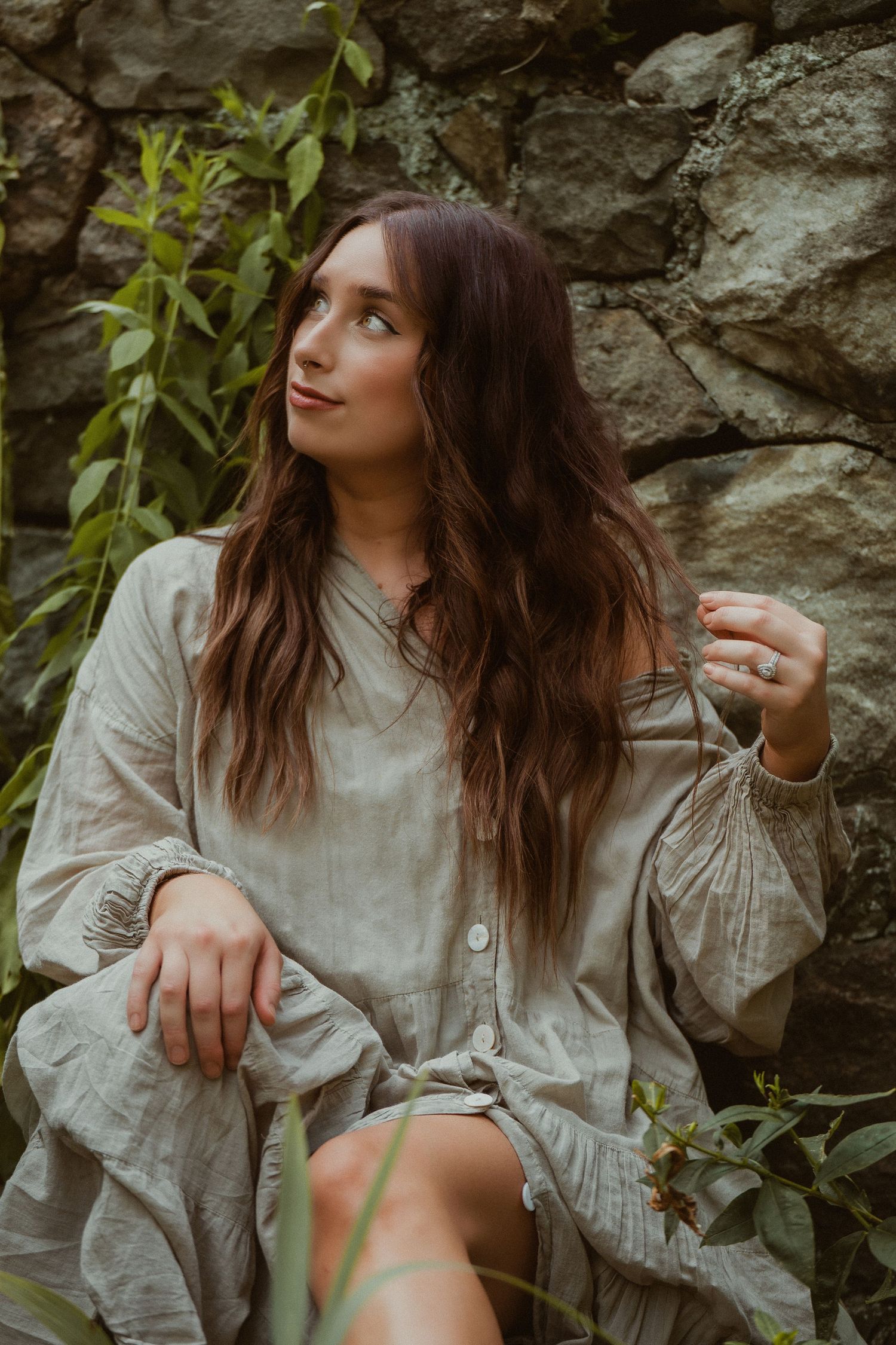 Romantic portrait in vintage white blouse against rocky natural backdrop. Fremont, Ohio Hair Salon