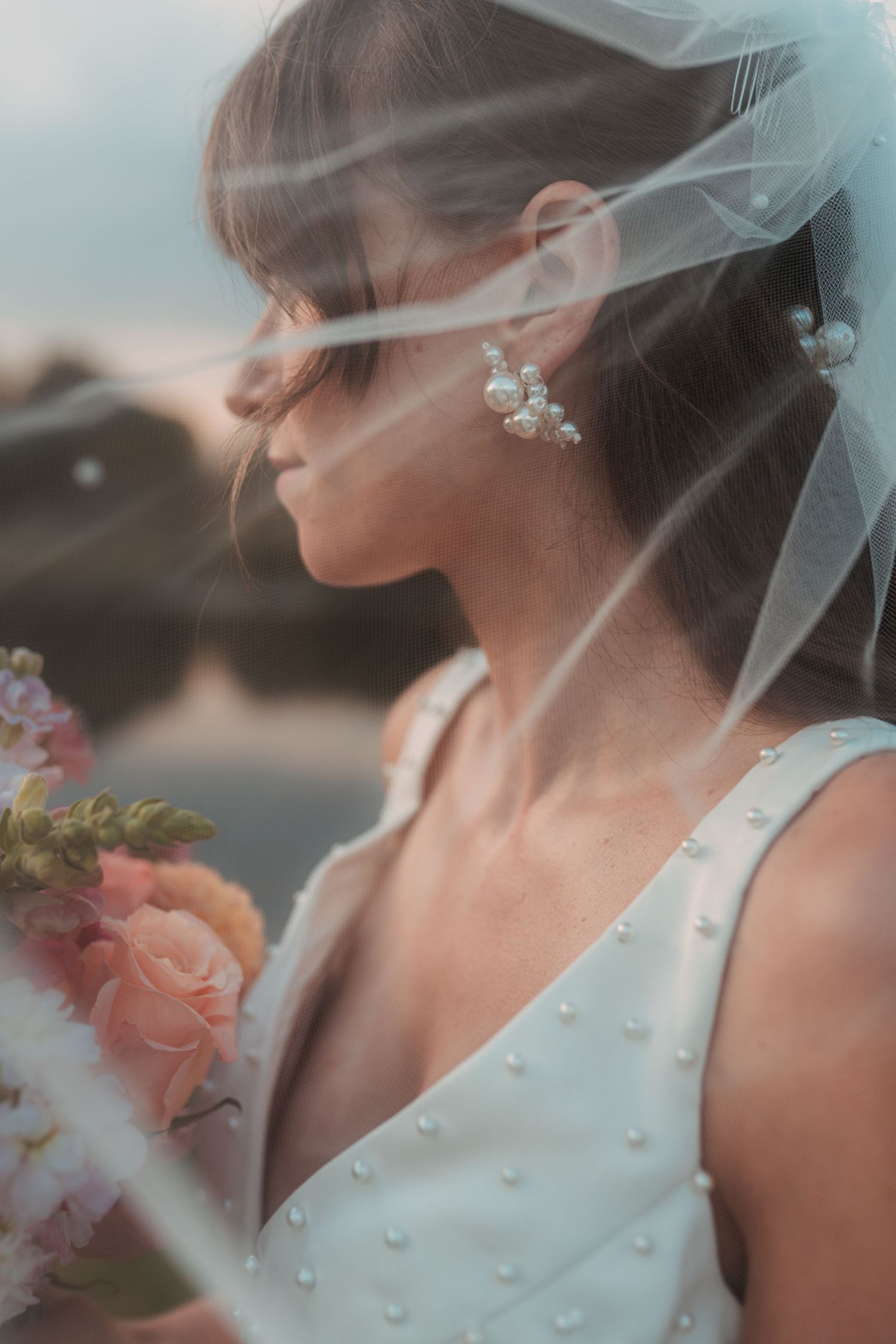 Close-up details of a bridal veil with pearl embellishments and delicate lace. Wooster Ohio The Wellspring Wedding Venue