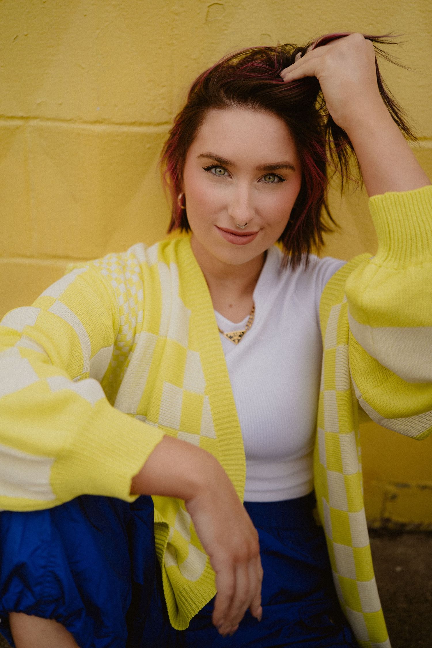 Casual fashion photos featuring yellow and white clothing against a yellow wall.  Clyde, Ohio