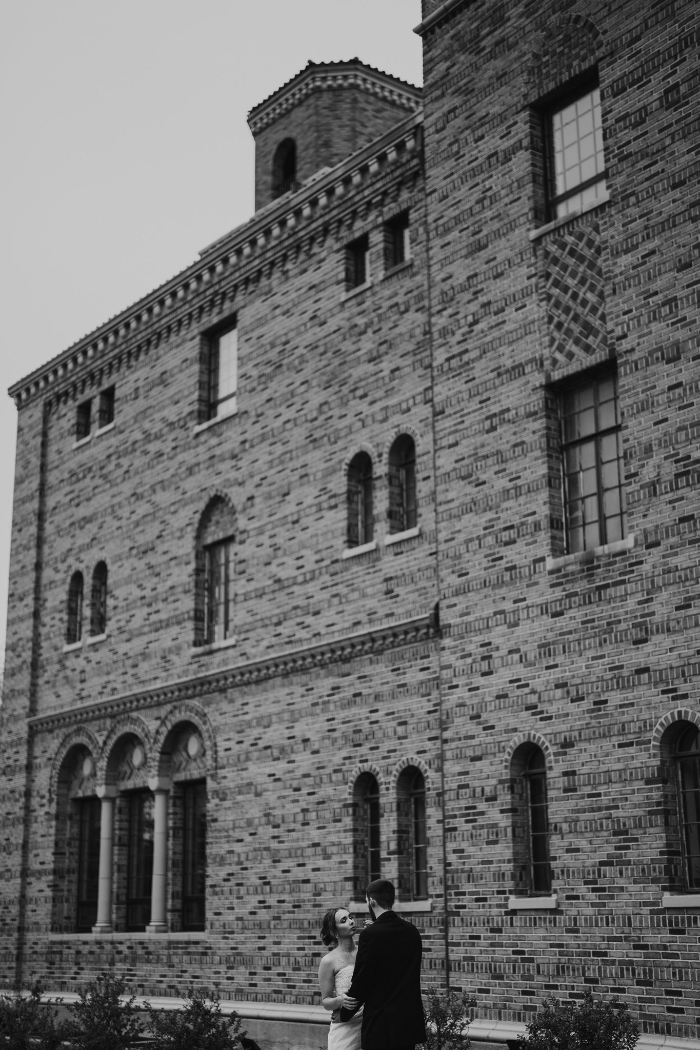 Historic brick building with arched windows and architectural details in black and white. Nazareth hall, grand rapids, OHIO