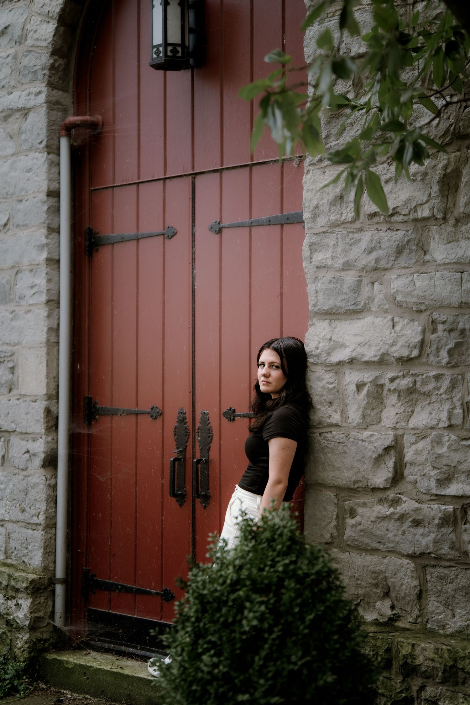 Stone wall with large pink door creates rustic architectural backdrop. Sandusky Ohio