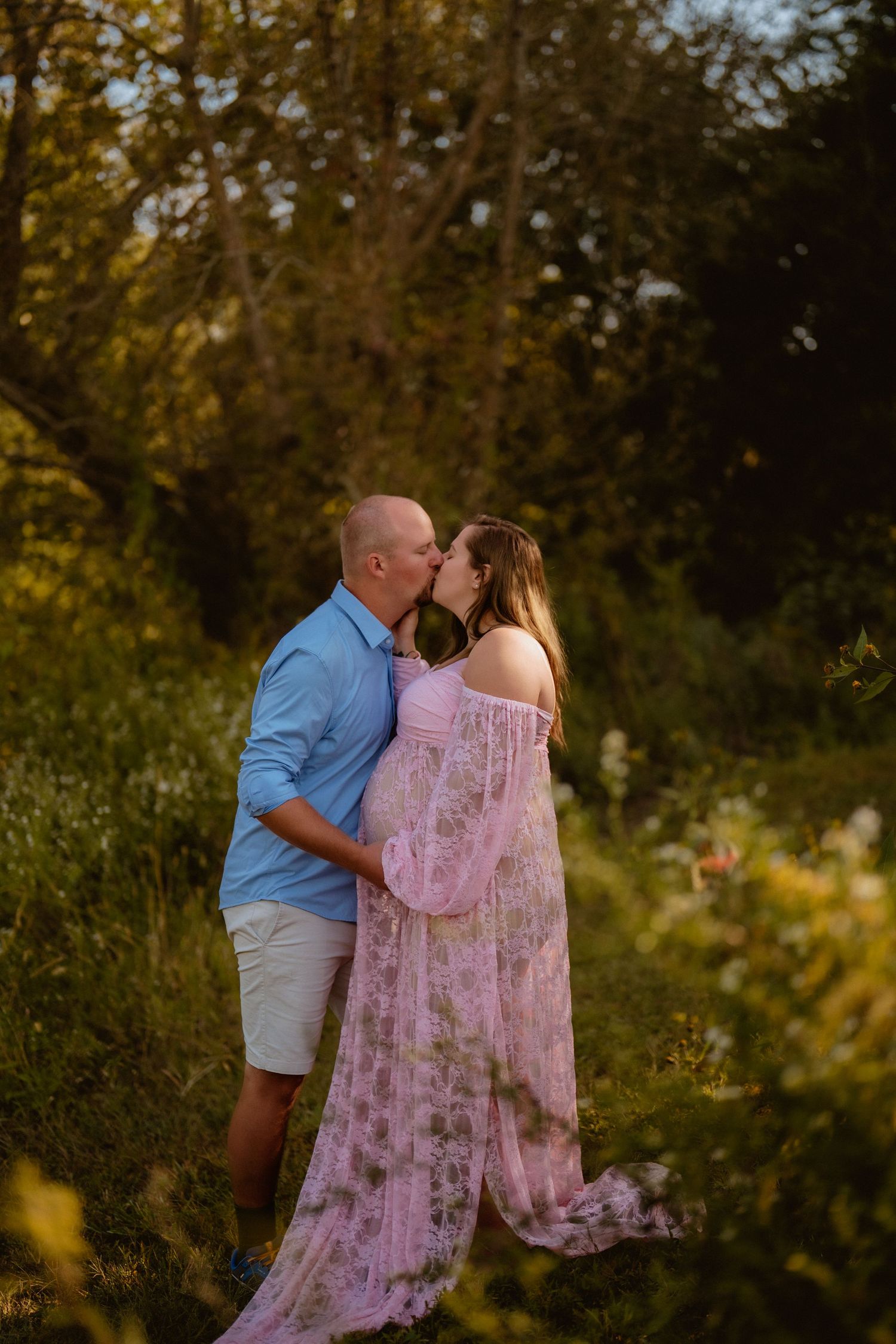 Romantic couple sharing tender moments at sunset in a natural outdoor setting. Steyer Nature Preserve Tiffin, Oh