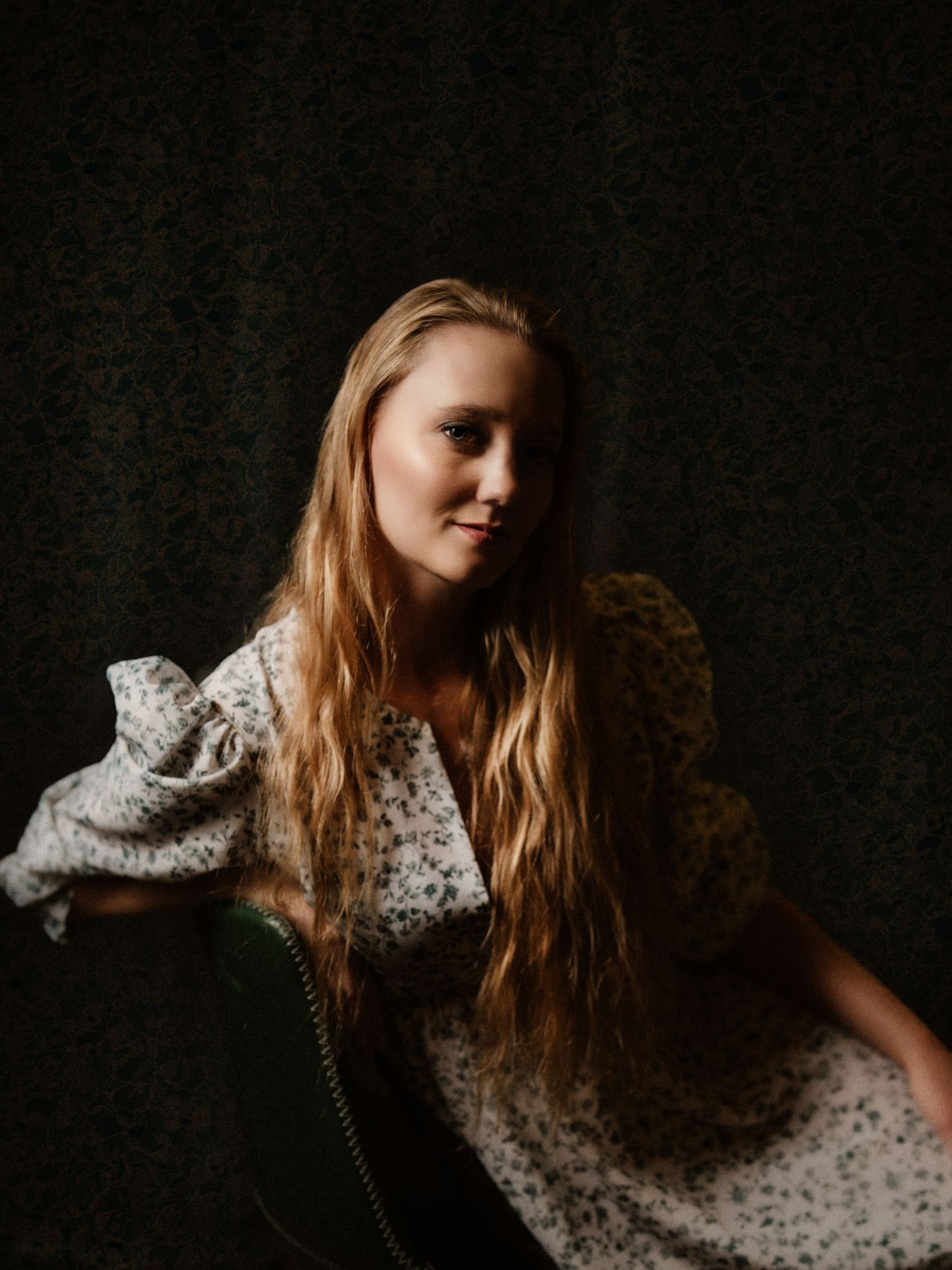 Artistic fashion portrait in floral dress with dramatic dark studio lighting.  Clyde, Ohio