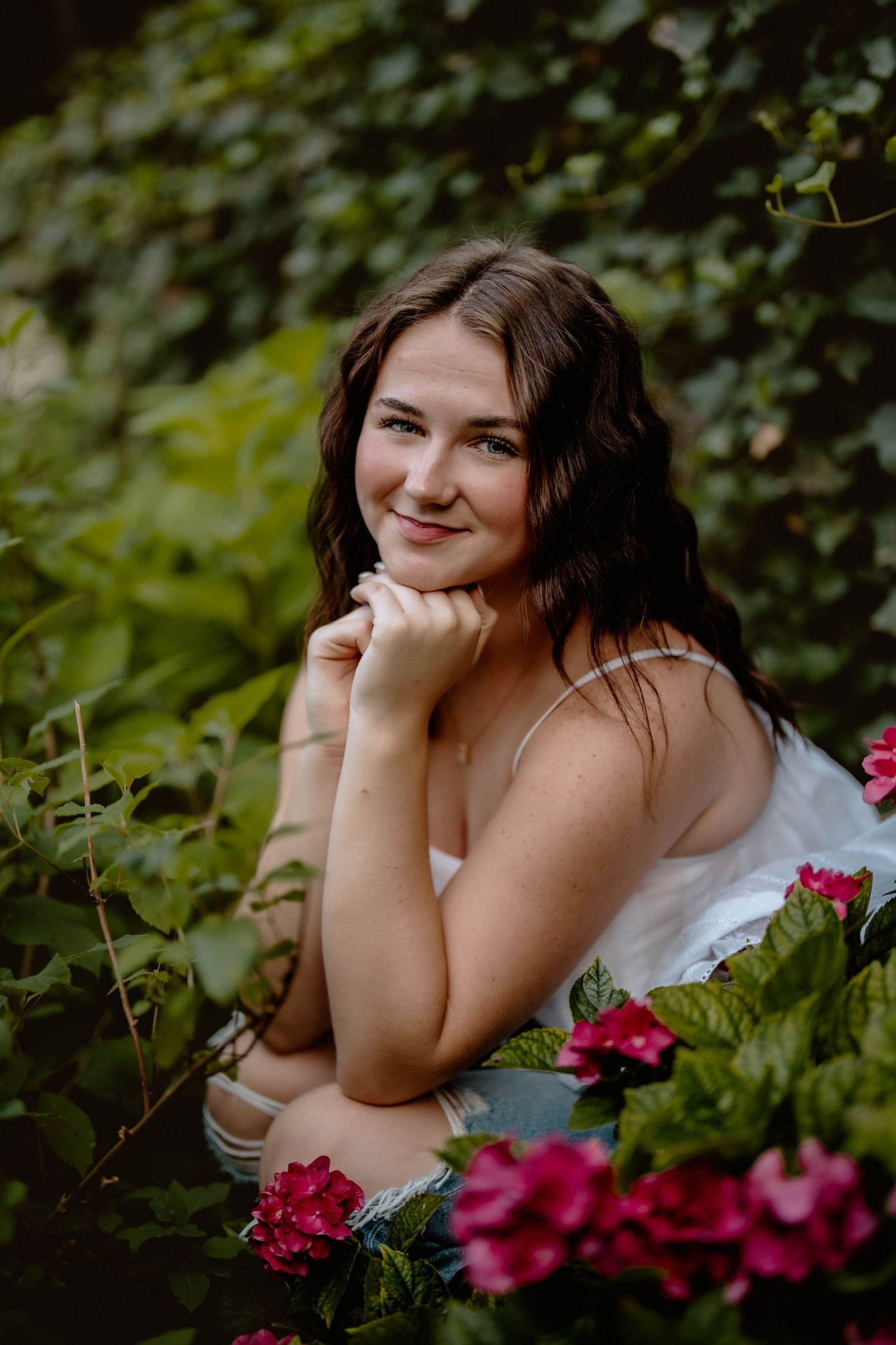 Artistic portrait among pink flowers with natural greenery backdrop. Schedel Gardens, Elmore, Ohio