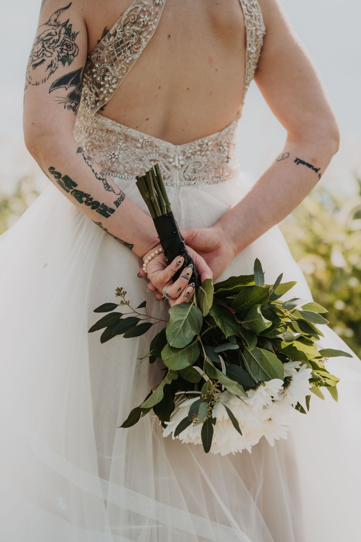 White wedding dress and floral bouquet details shown in multiple artistic angles. Tiffin, Ohio Wedding Venue