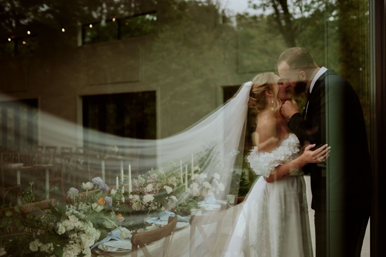 Elegant wedding portraits through window reflections with natural light. Wooster Ohio The Wellspring Wedding Venue