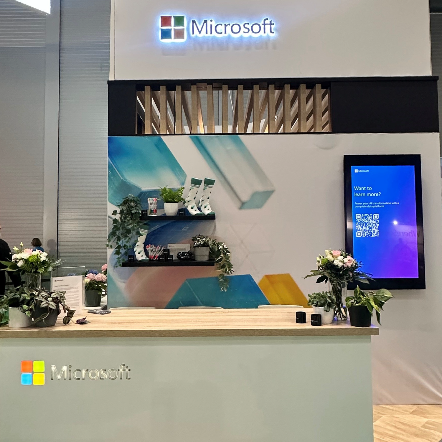 Modern Microsoft office space with clean design, displays and branded elements.