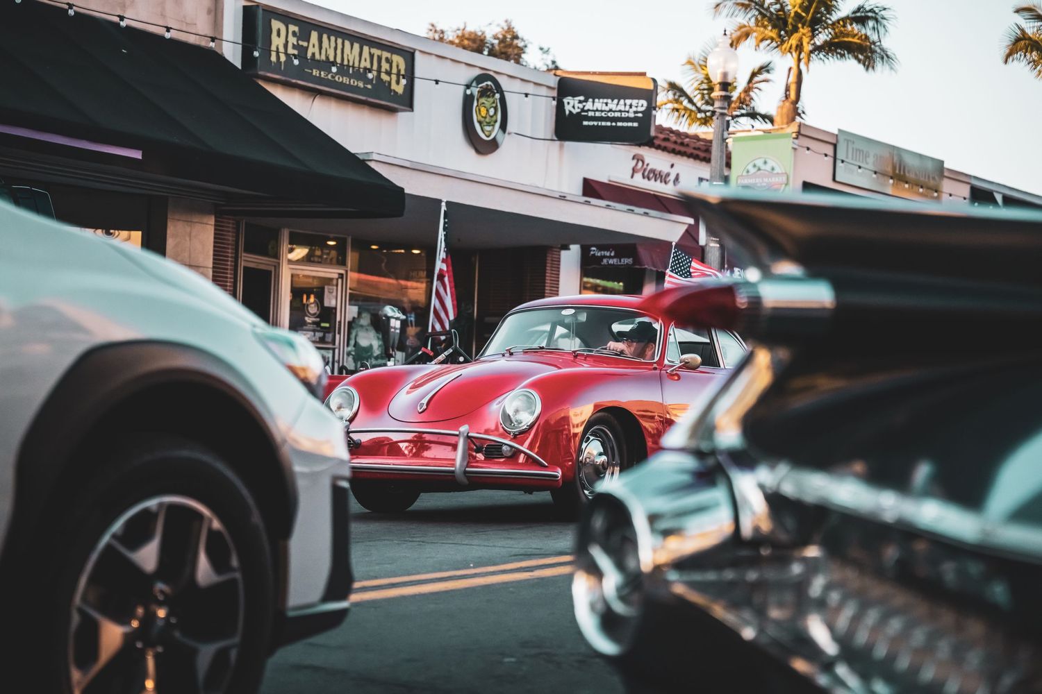 Low angle view of classic vintage cars lined up at an automotive show.