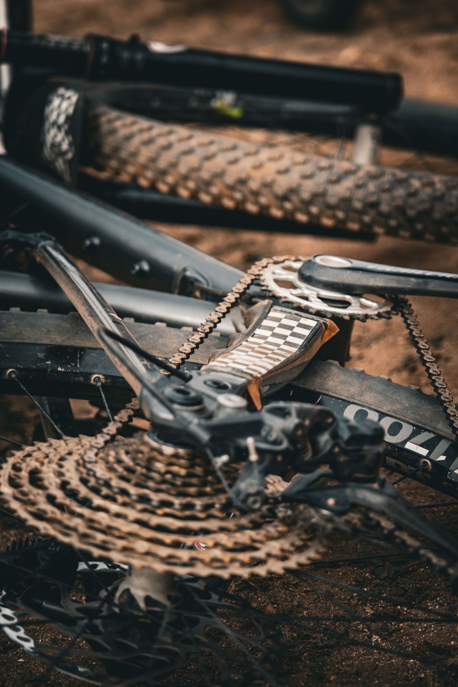 Detailed macro shot of mountain bike gears and chain components.