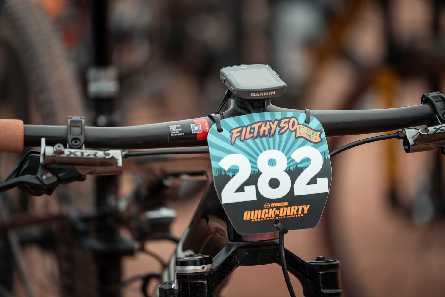 Close-up detail of mountain bike handlebars and controls.