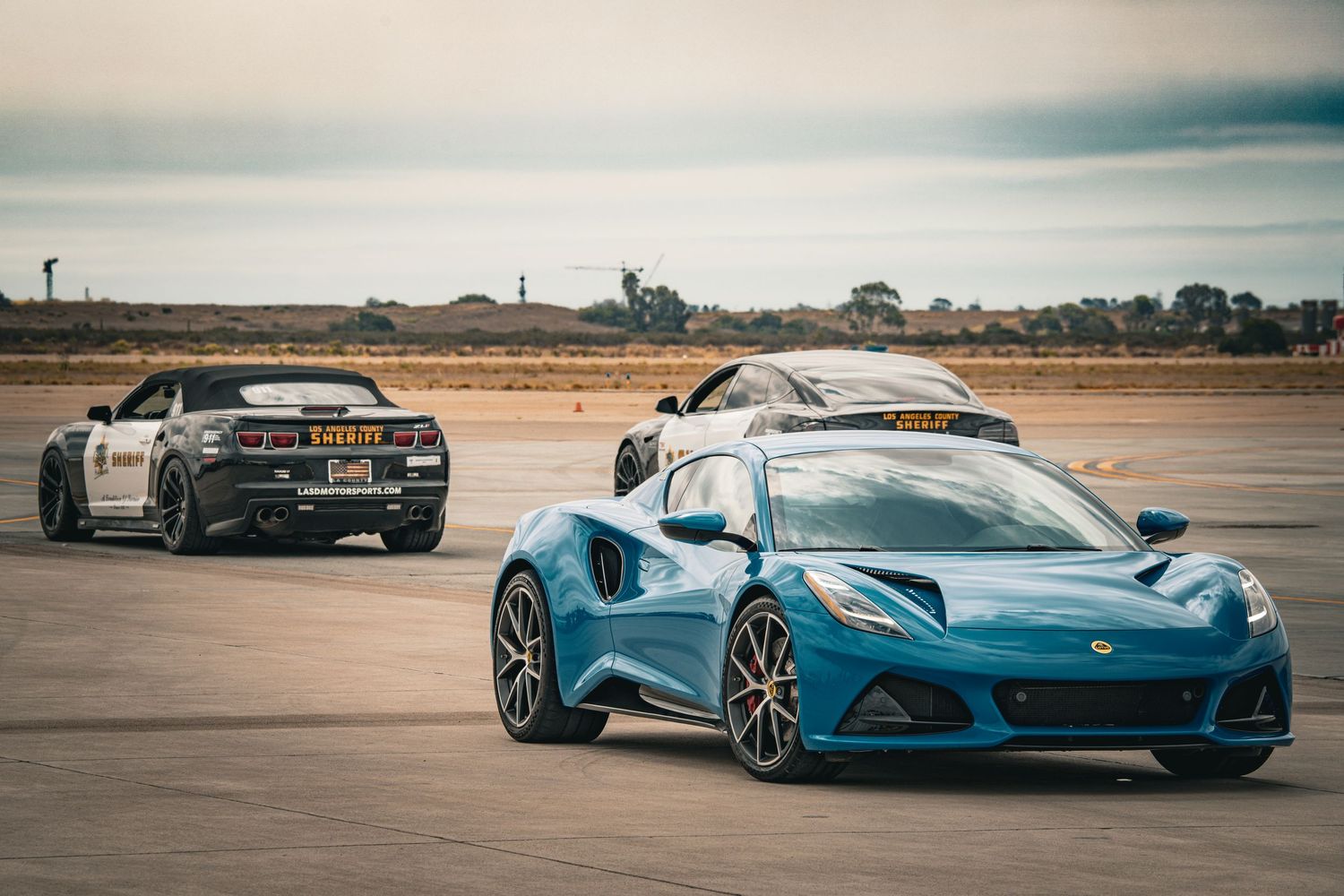 Collection of modern supercars including McLaren and other exotic vehicles on display.