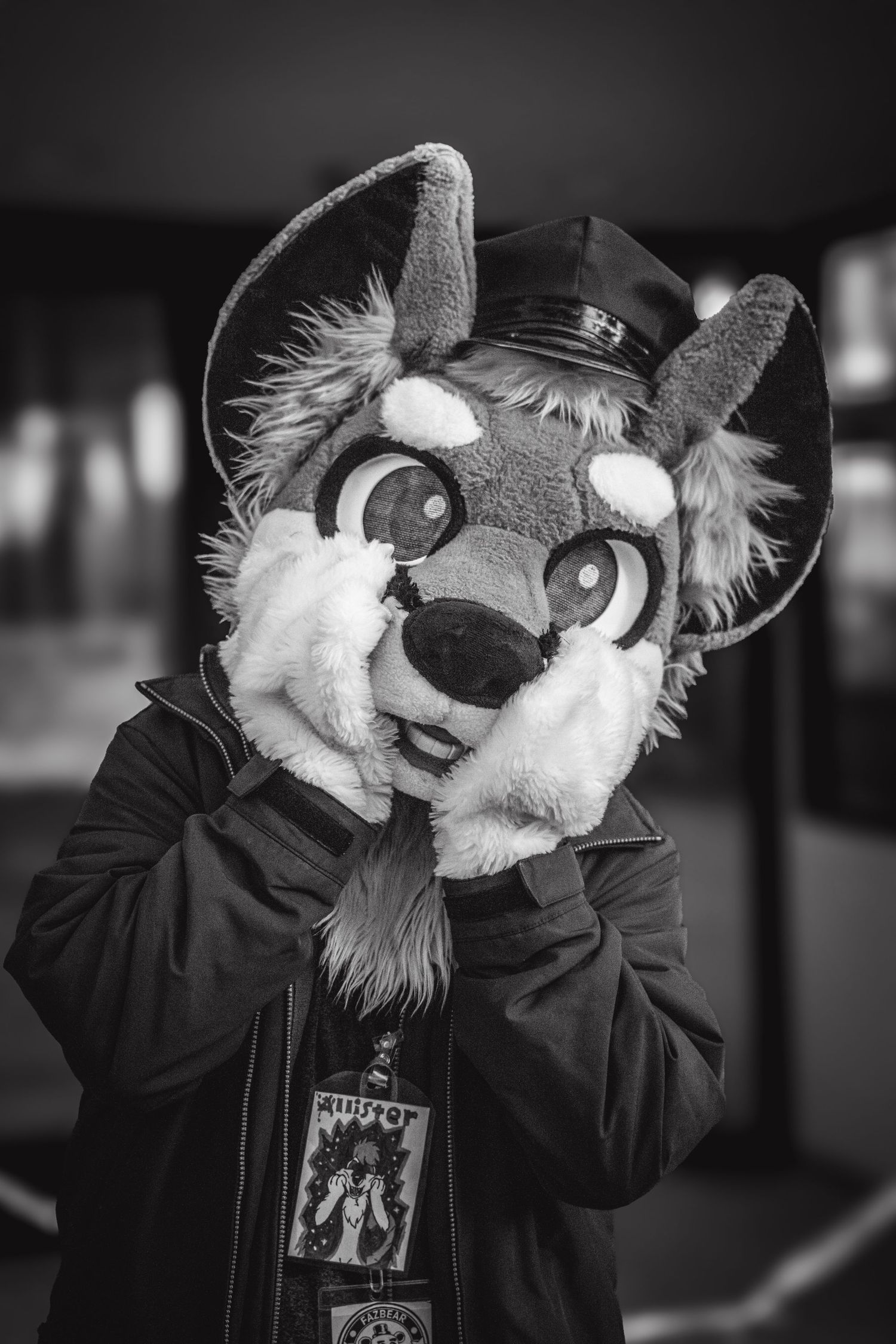 Black and white photo series of two people in furry animal costumes embracing and interacting.