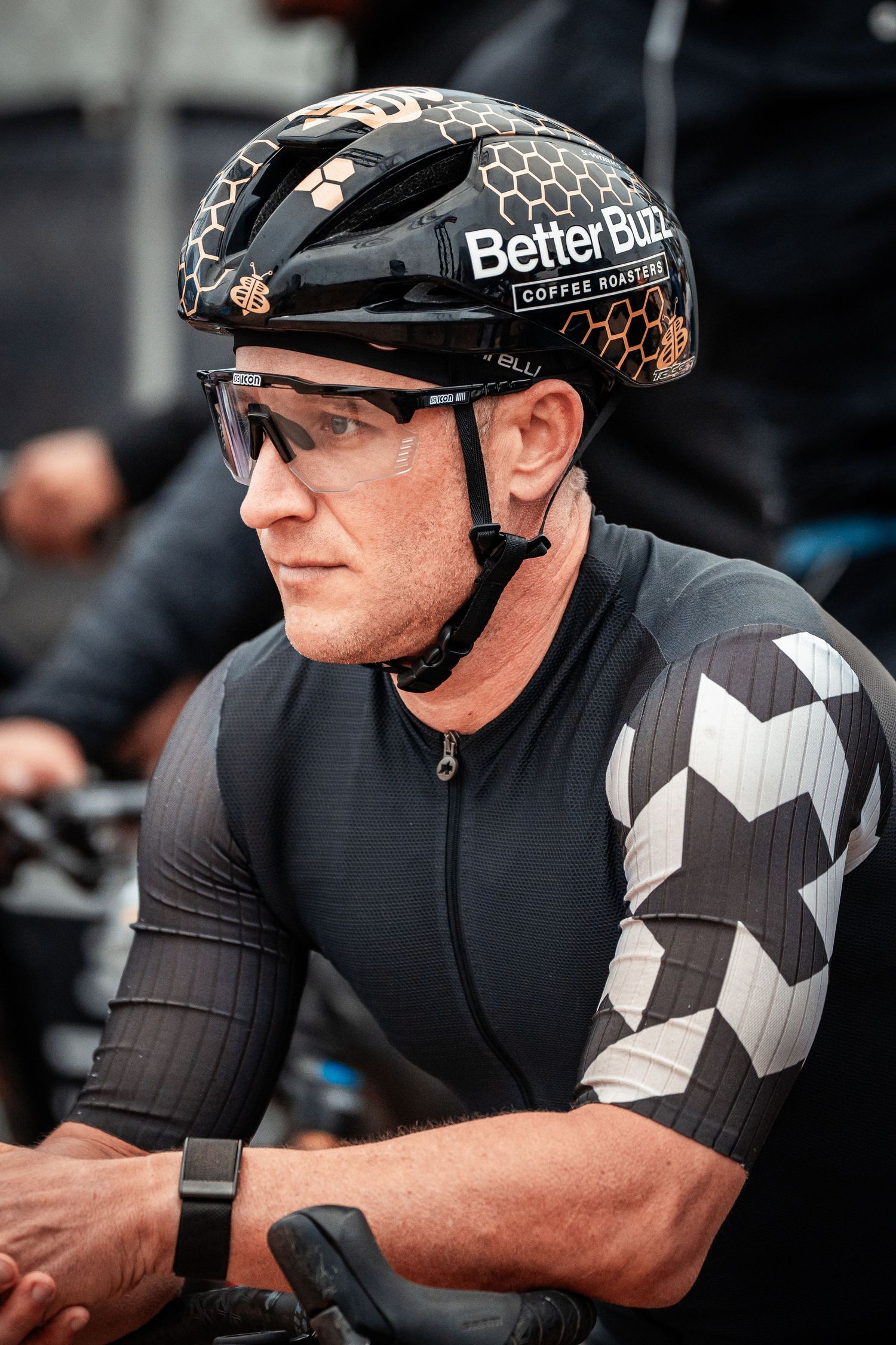 Athlete in cycling gear and protective equipment during competition.