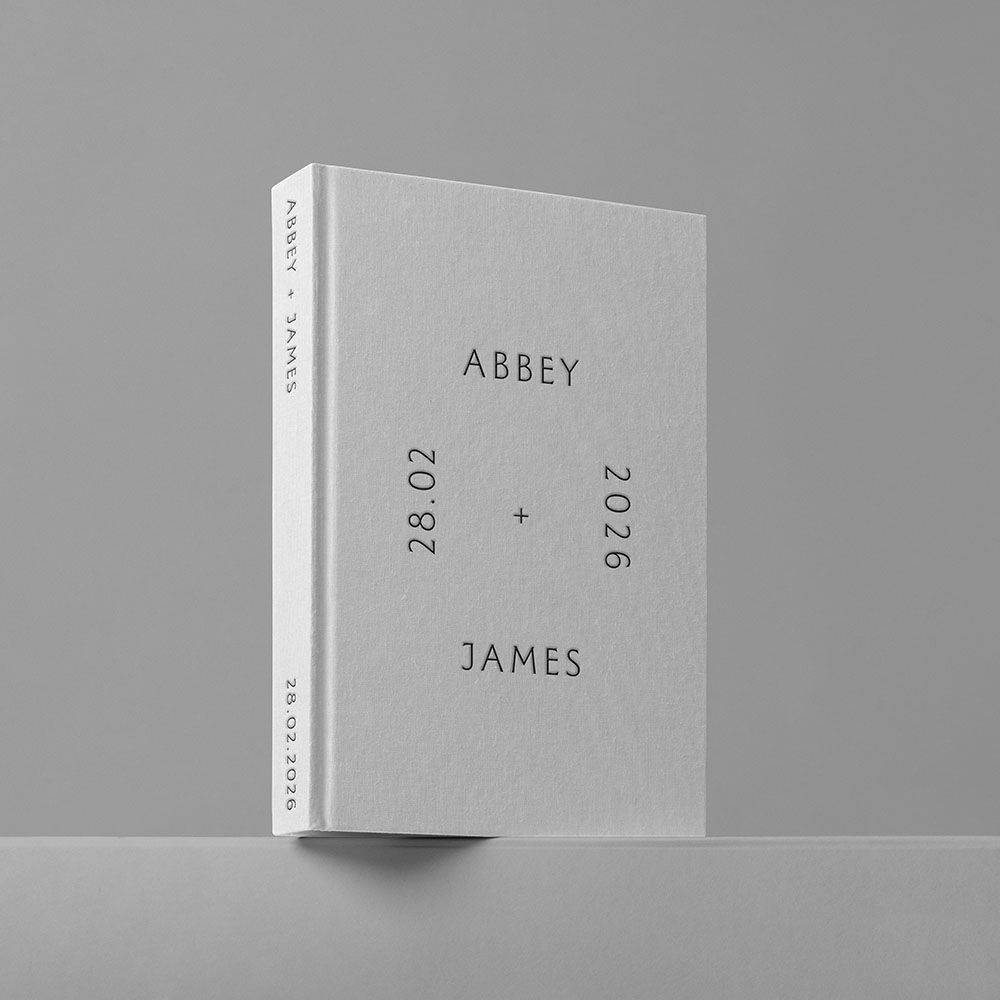 Minimalist gray hardcover wedding guest book personalized with Abbey and James, dated 28.02.2026.