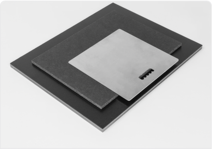 A sleek gray and silver digital drawing tablet with minimalist design lies on a white surface.