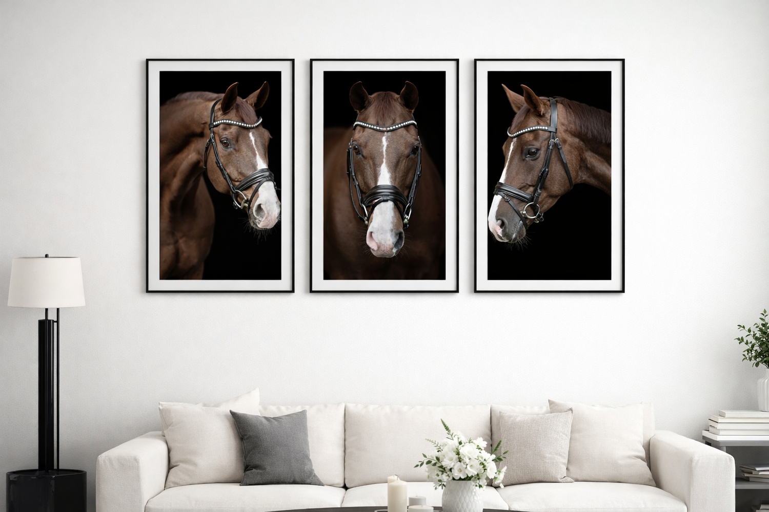 Three framed horse portraits in dramatic lighting displayed above modern gray sofa.