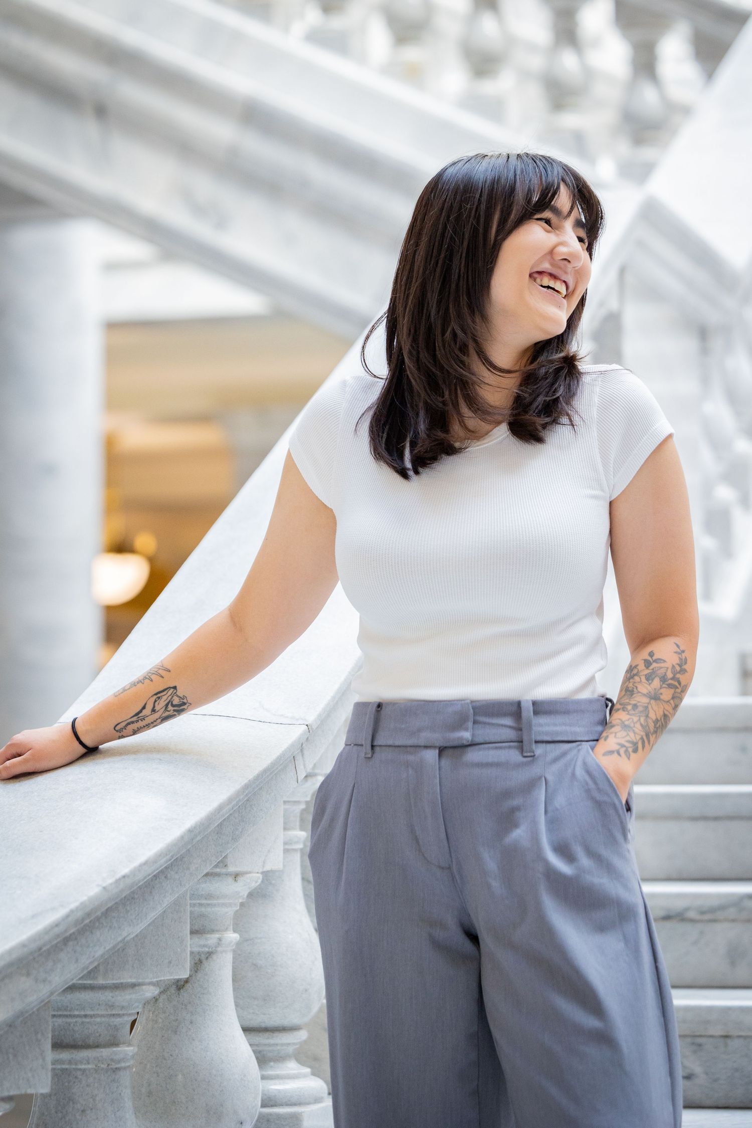Modern fashion portraits captured against white marble columns and architectural details.